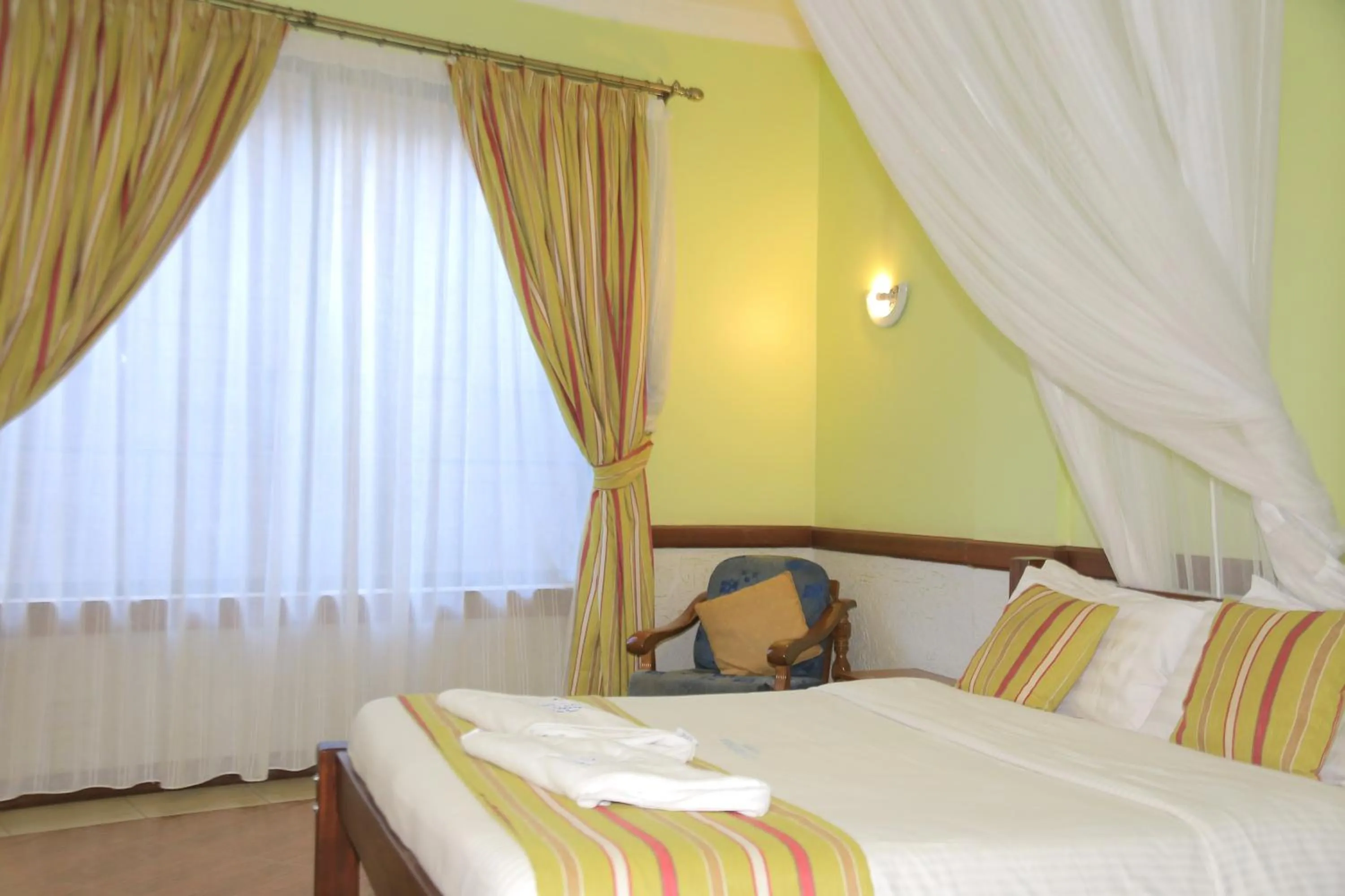 Bed in ACK Guest House Nairobi