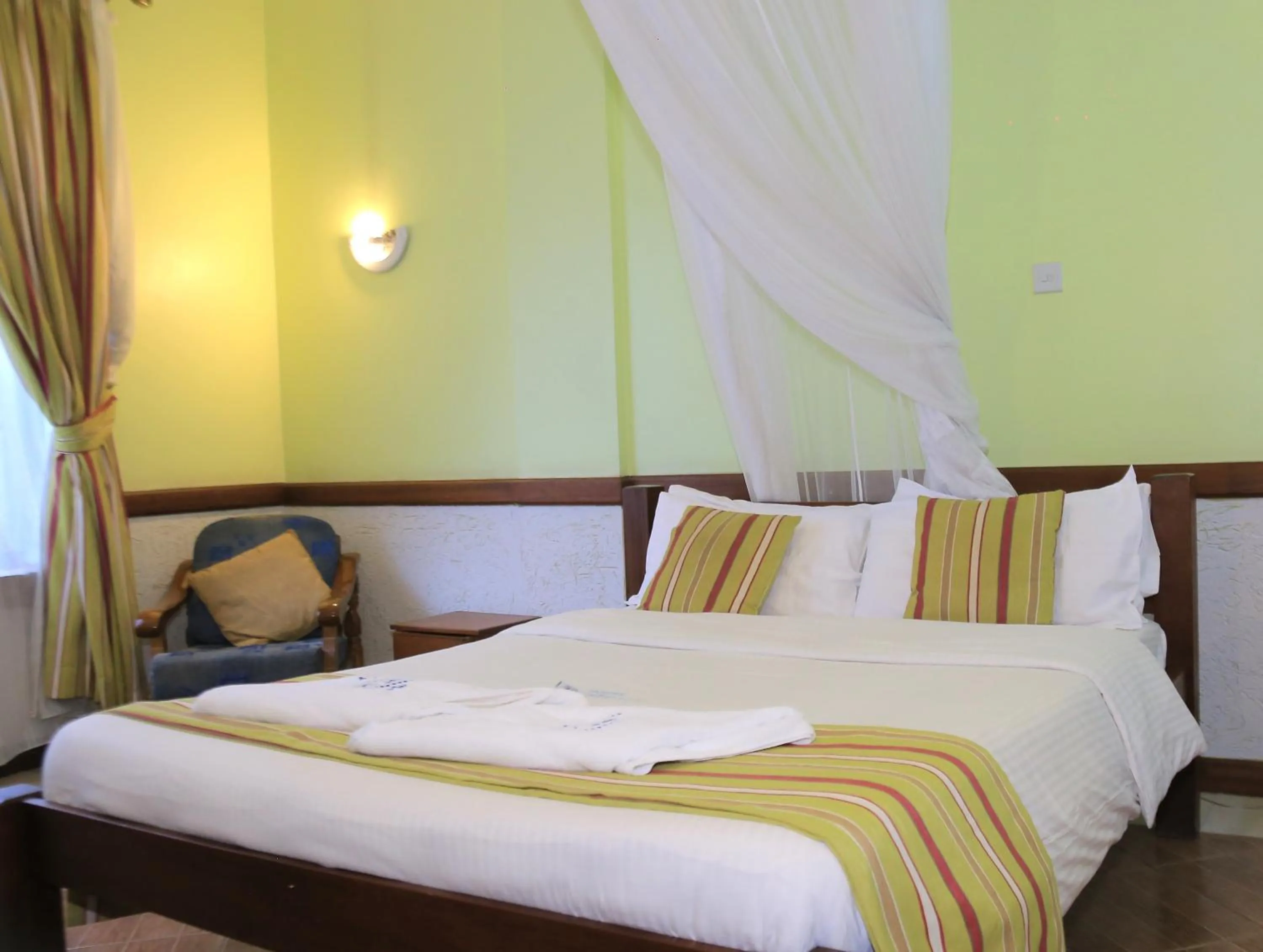Bed in ACK Guest House Nairobi