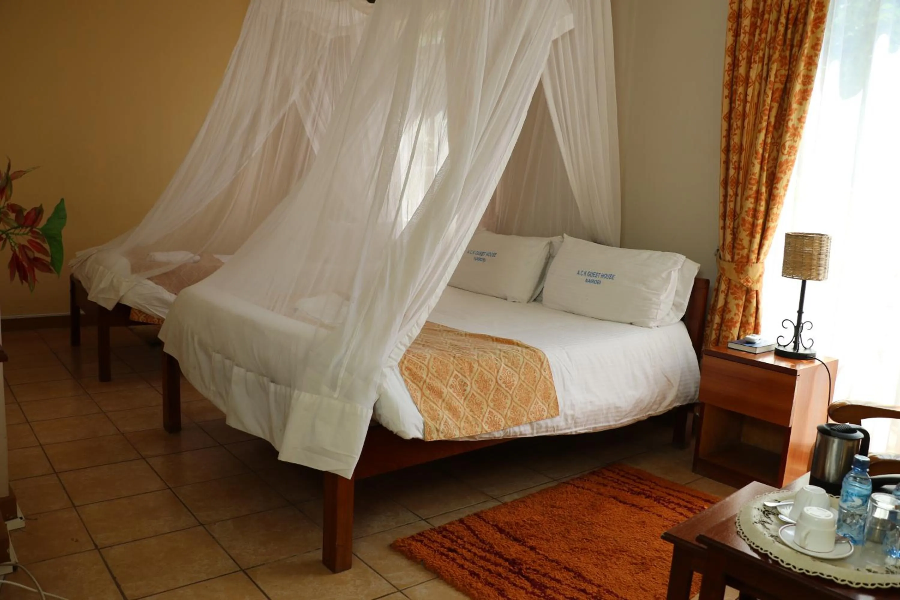 Bed in ACK Guest House Nairobi