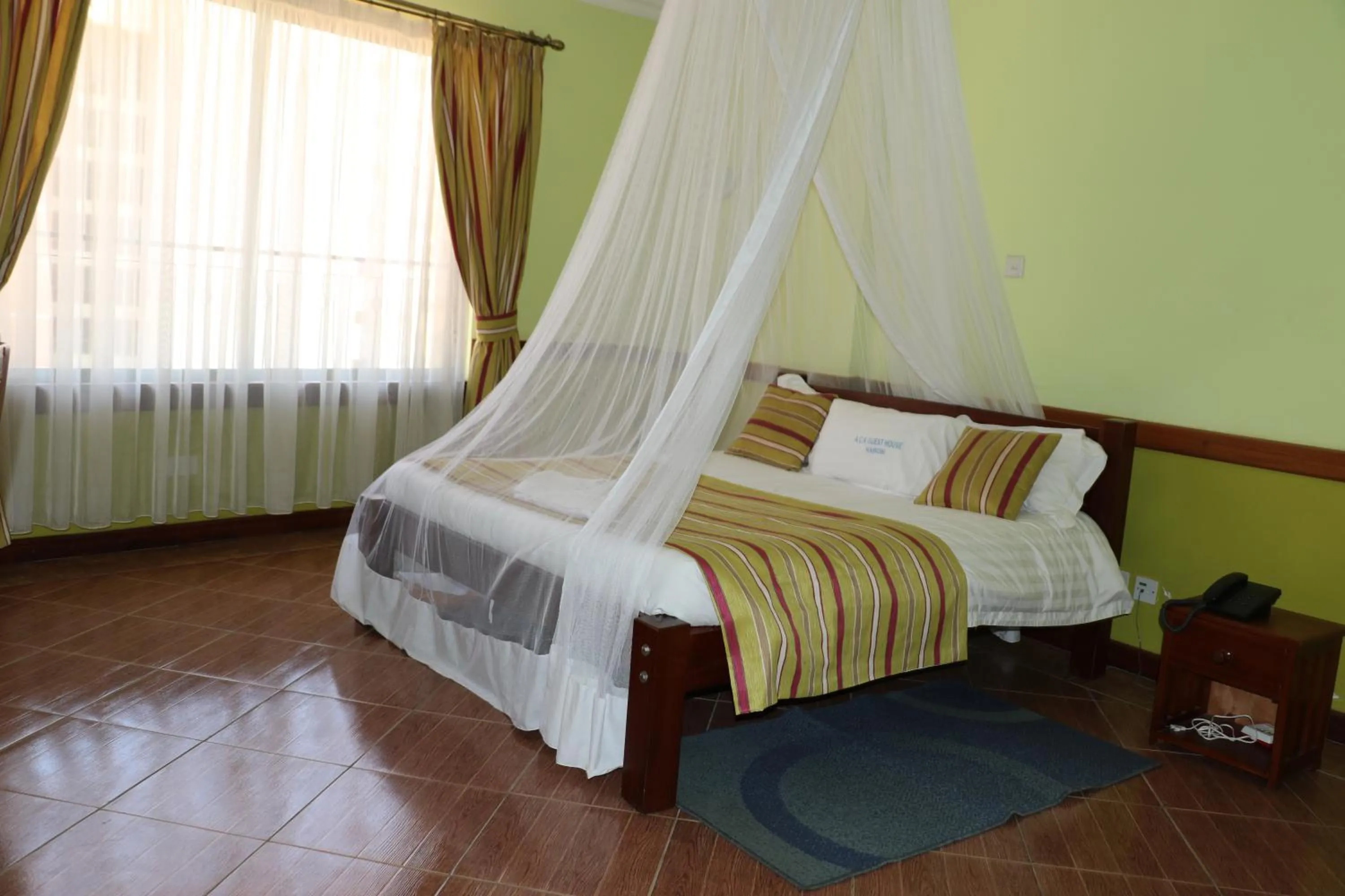 Bed in ACK Guest House Nairobi