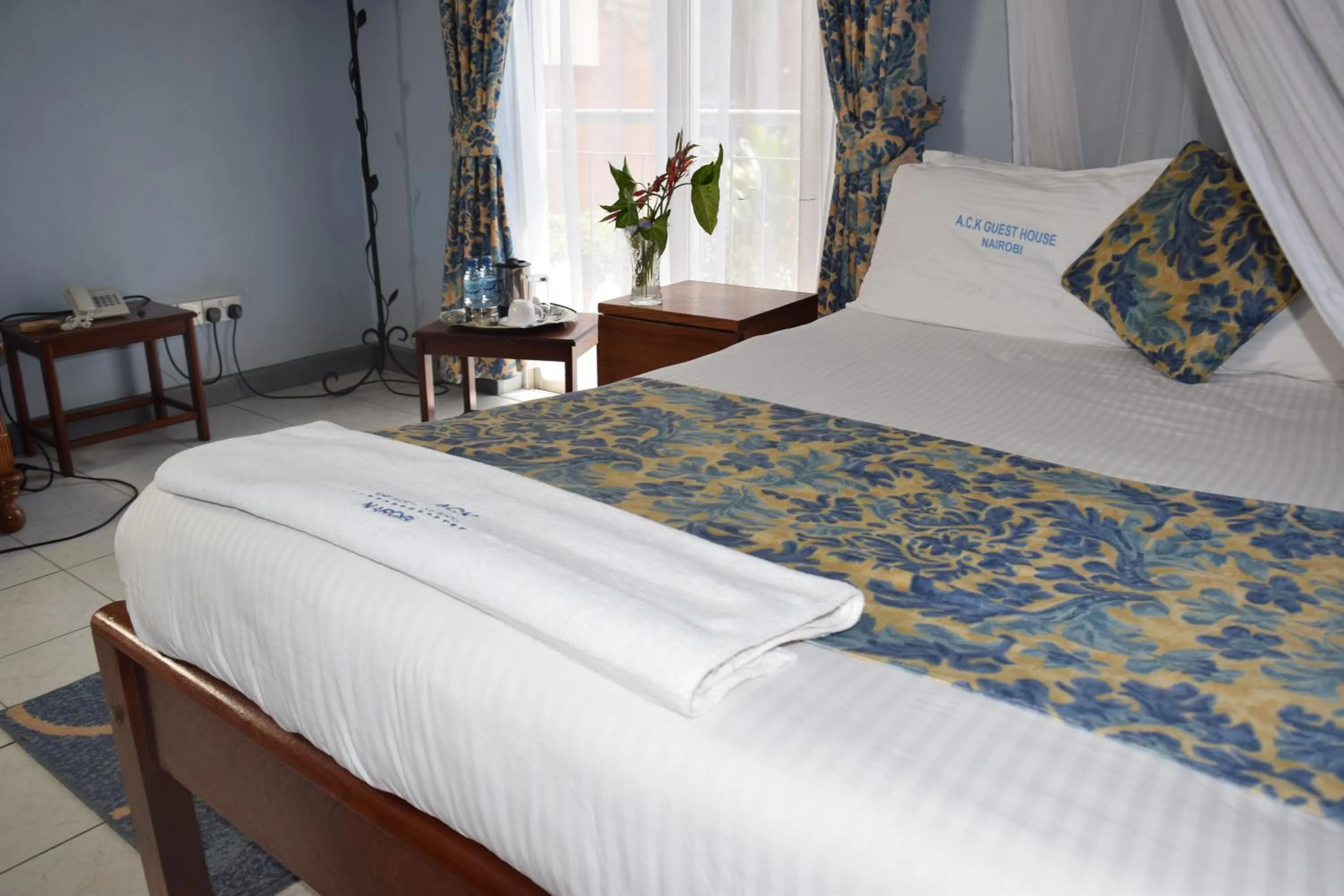 Bed in ACK Guest House Nairobi