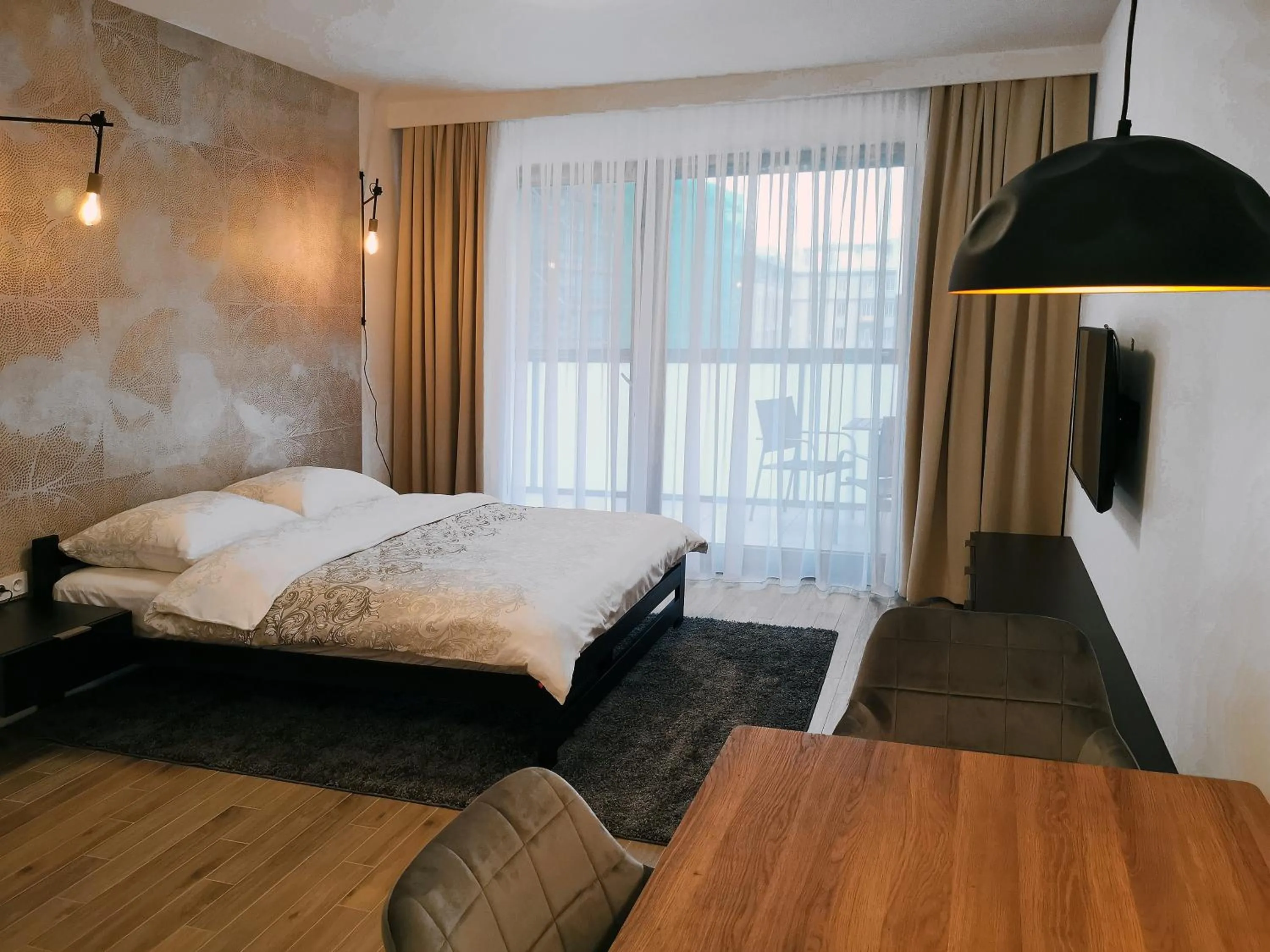 Bed in Come&Stay apartments Wola