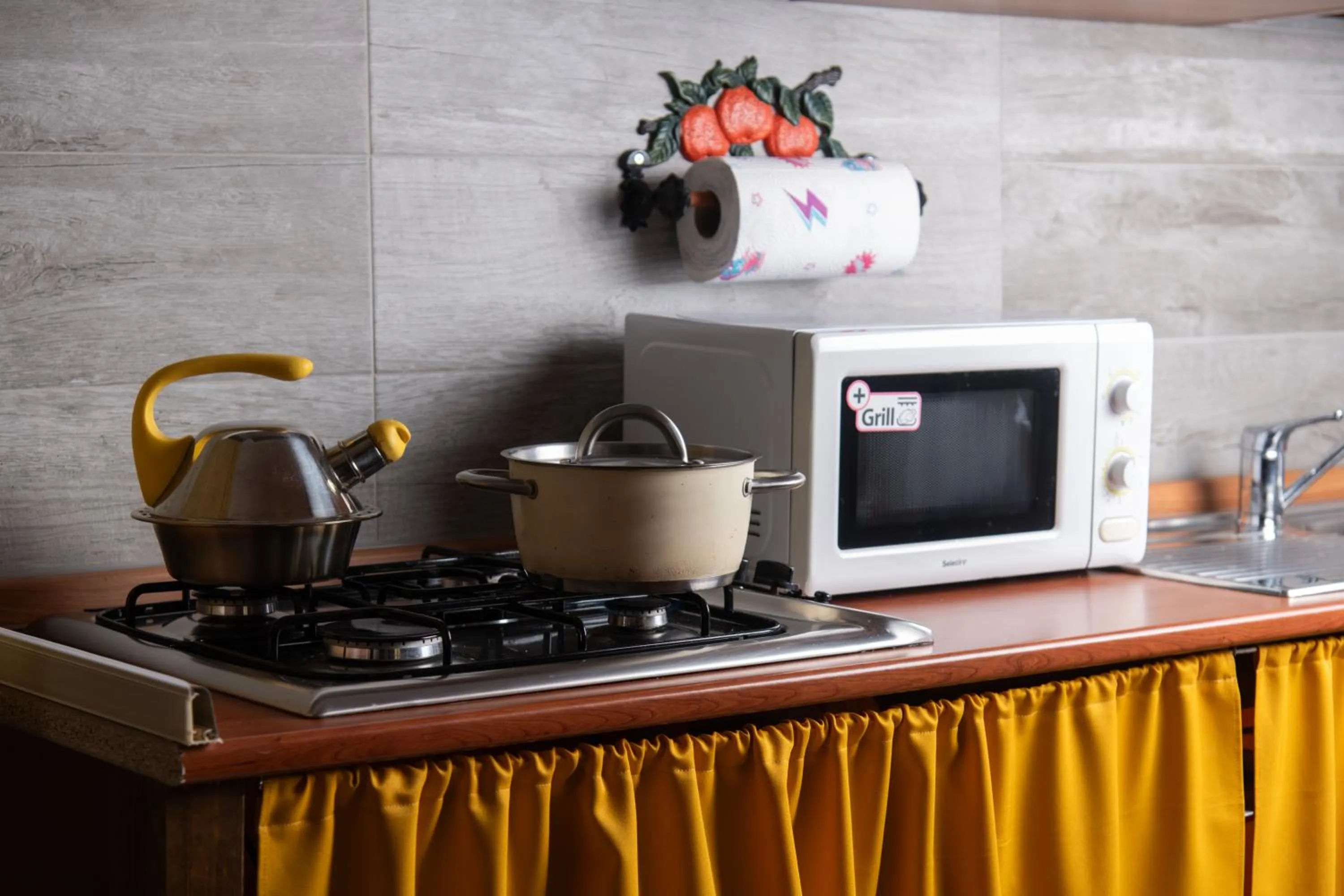 Kitchen or kitchenette in affittacamere S'Ortensia