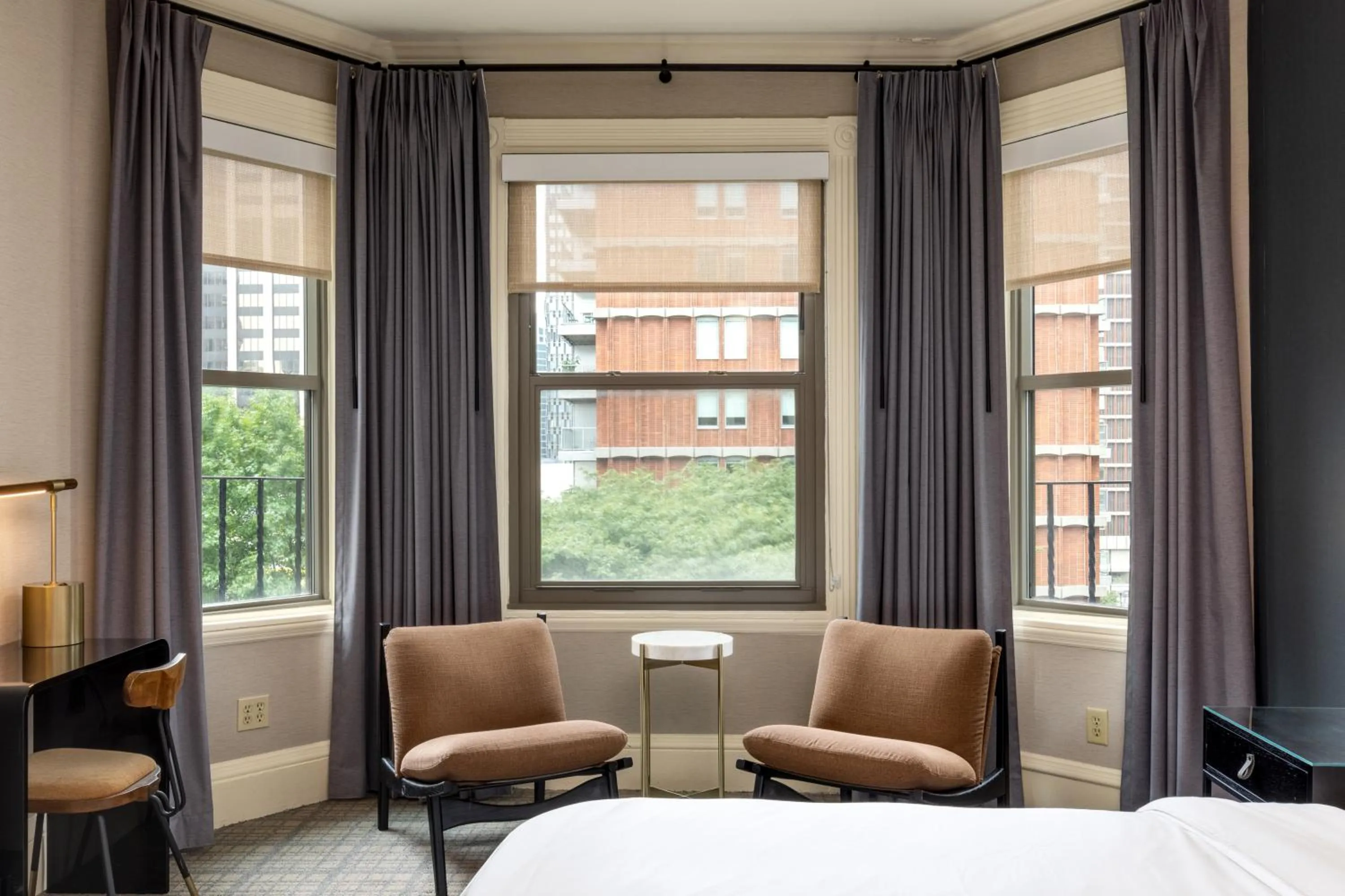 Seating area, Bed in Copley Square Hotel, a FOUND Hotel