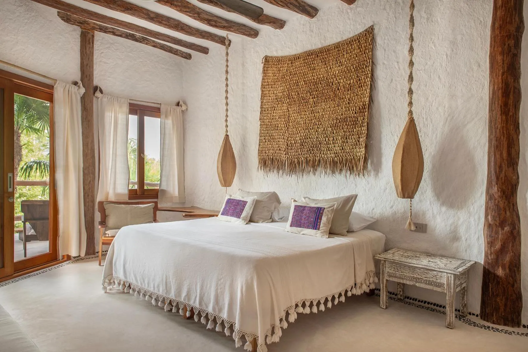 Bed in Mawimbi Boutique Hotel