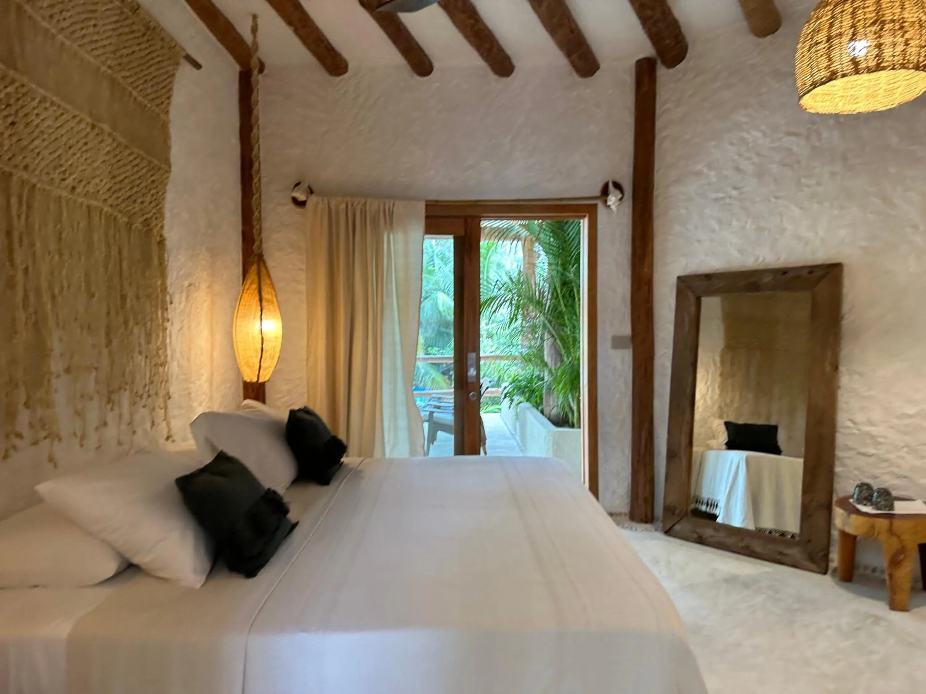 Bed in Mawimbi Boutique Hotel