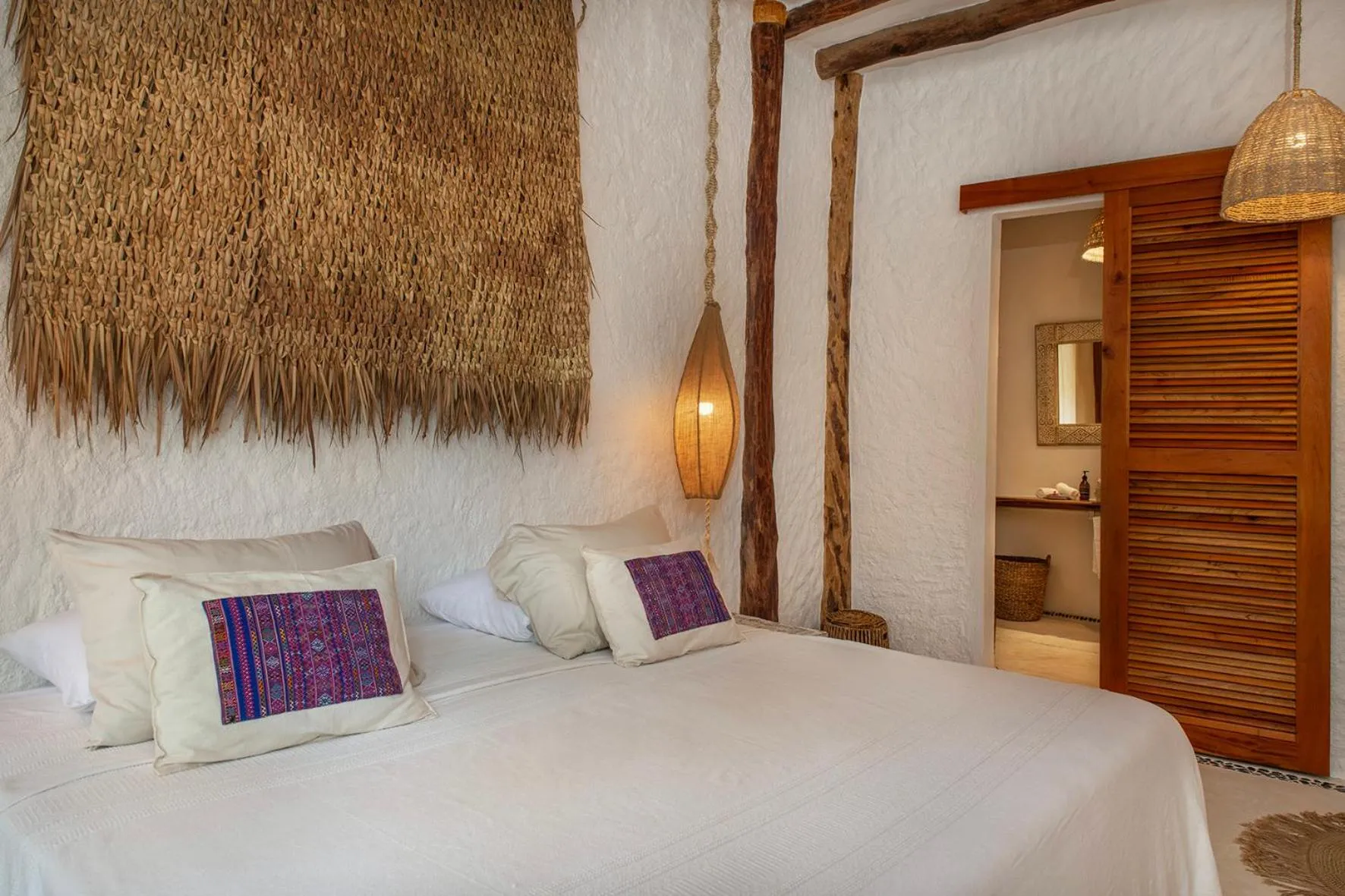 Bed in Mawimbi Boutique Hotel