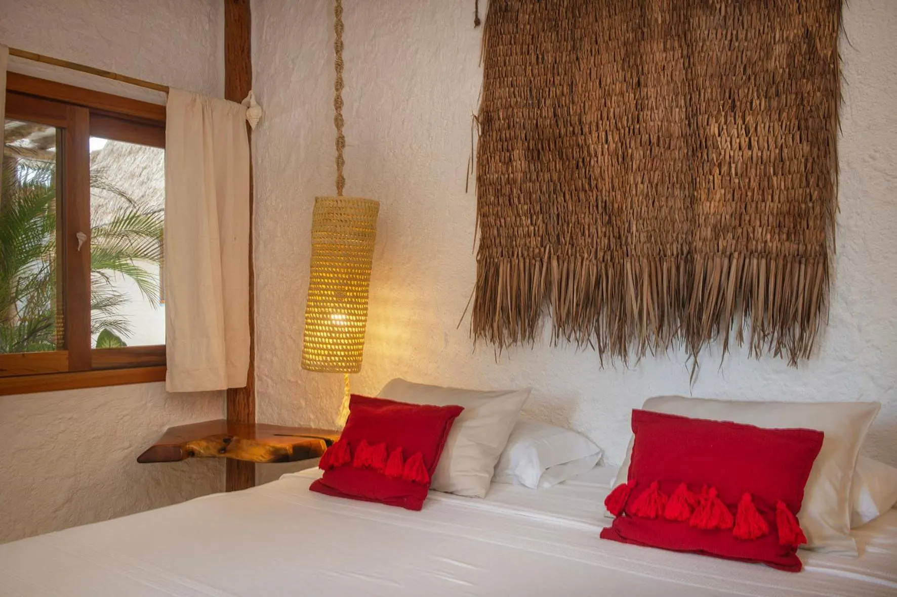 Bed in Mawimbi Boutique Hotel