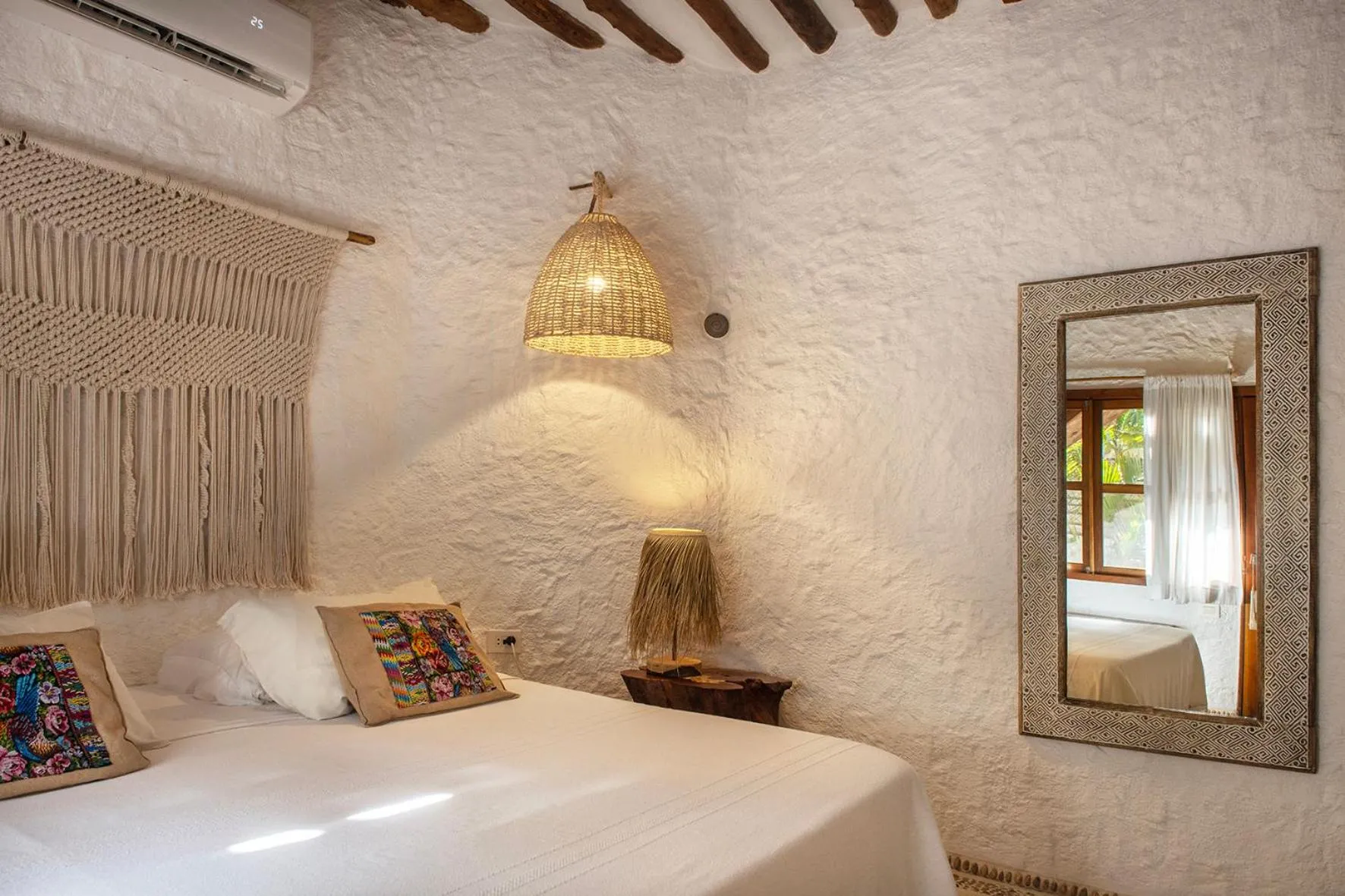 Bed in Mawimbi Boutique Hotel