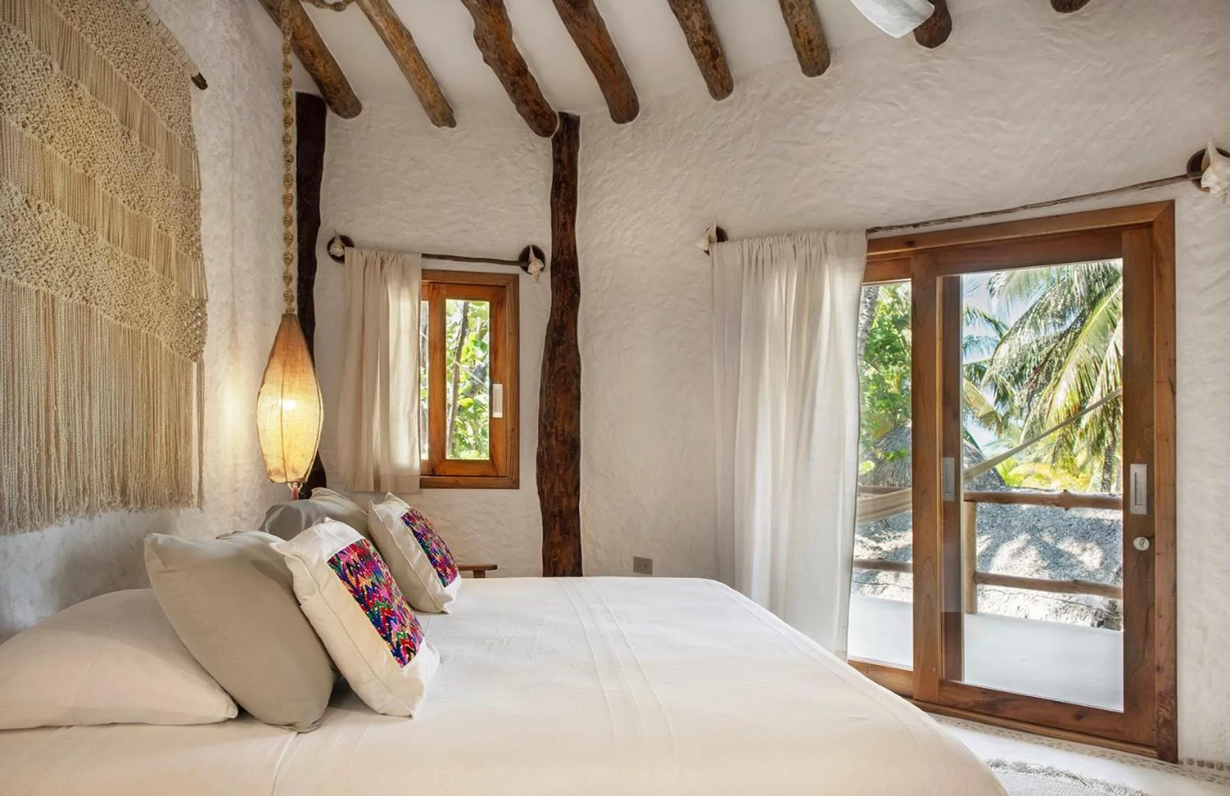 Bed in Mawimbi Boutique Hotel