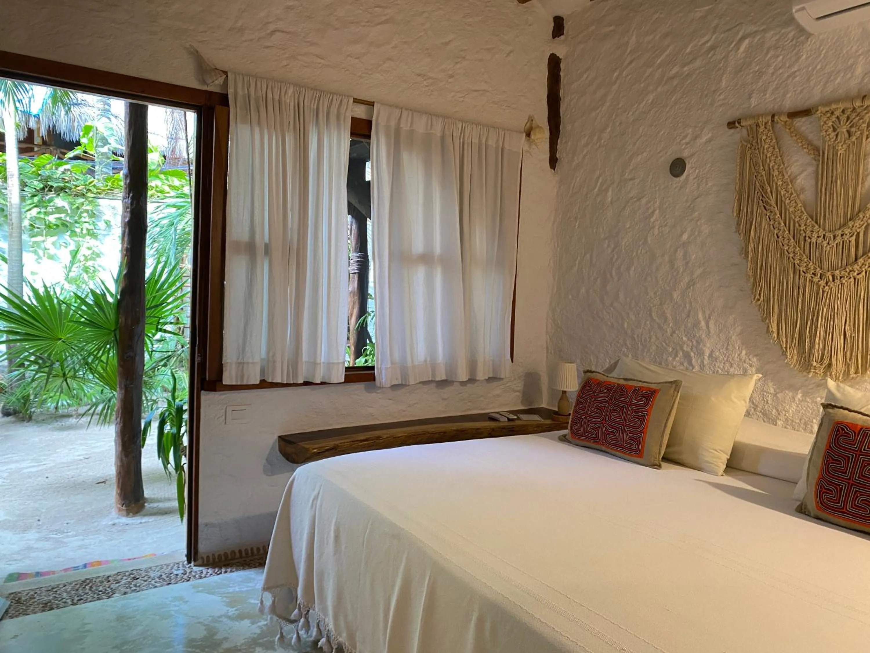 Bed in Mawimbi Boutique Hotel