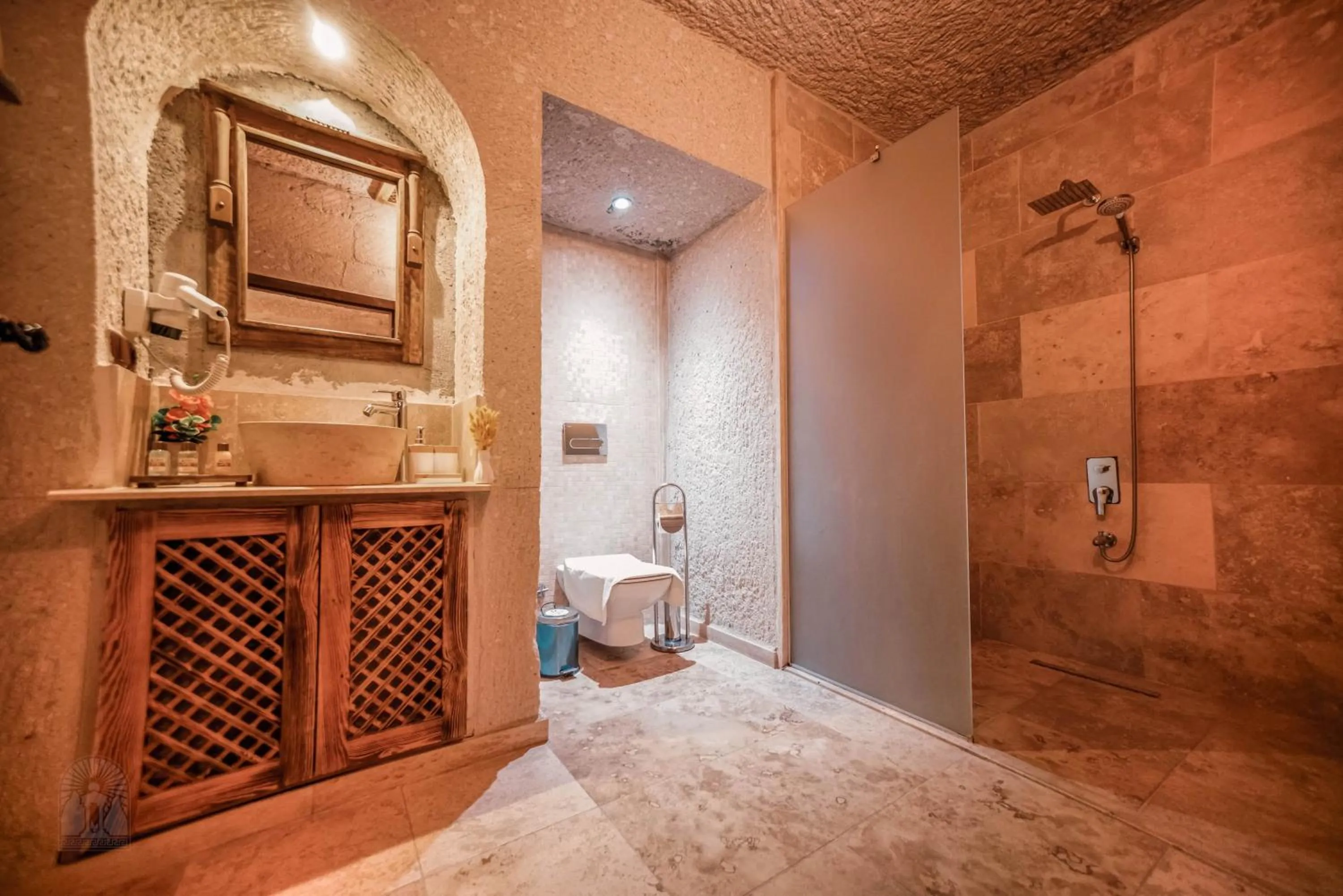 Toilet in Zeus Cave Suites