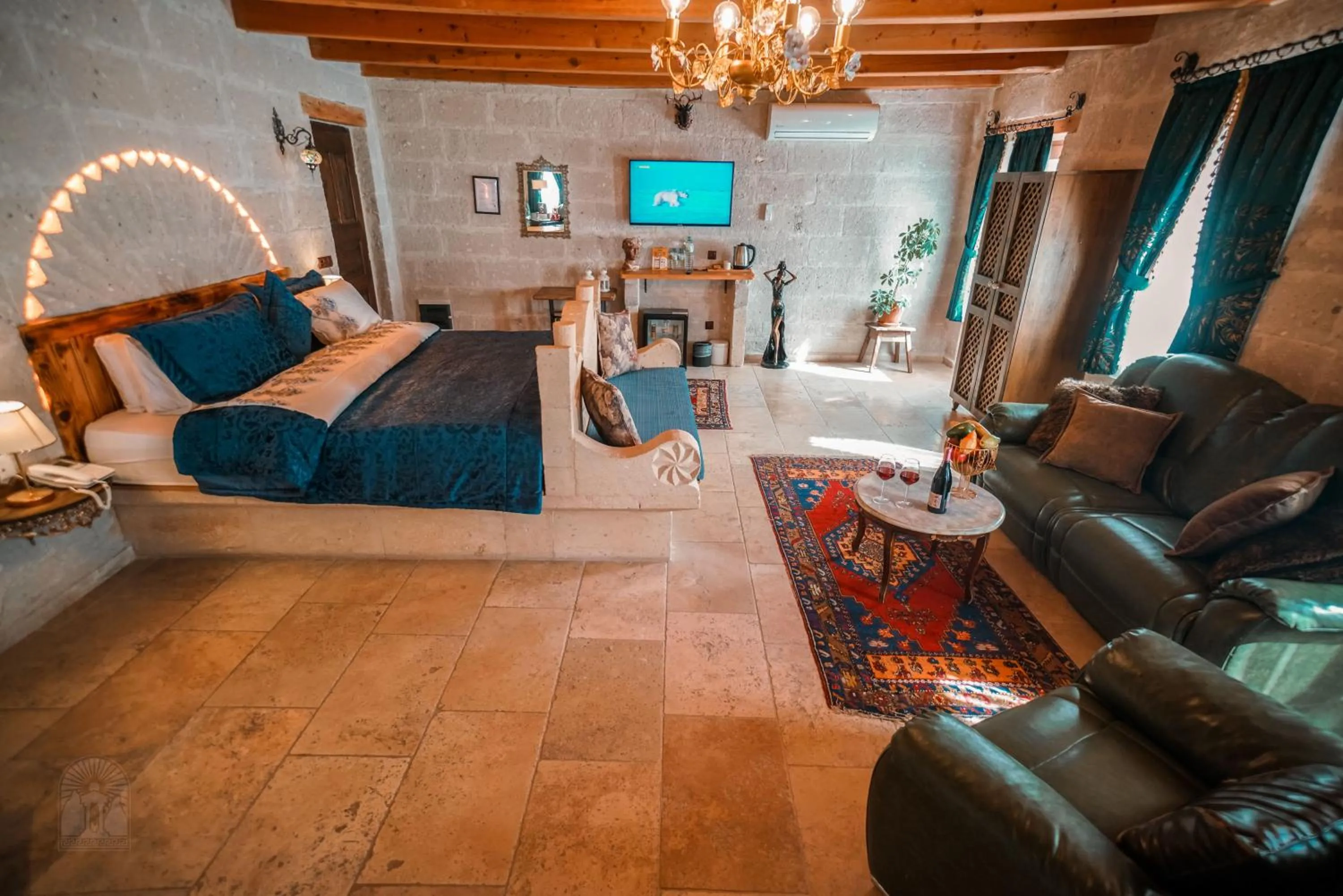 Bed in Zeus Cave Suites