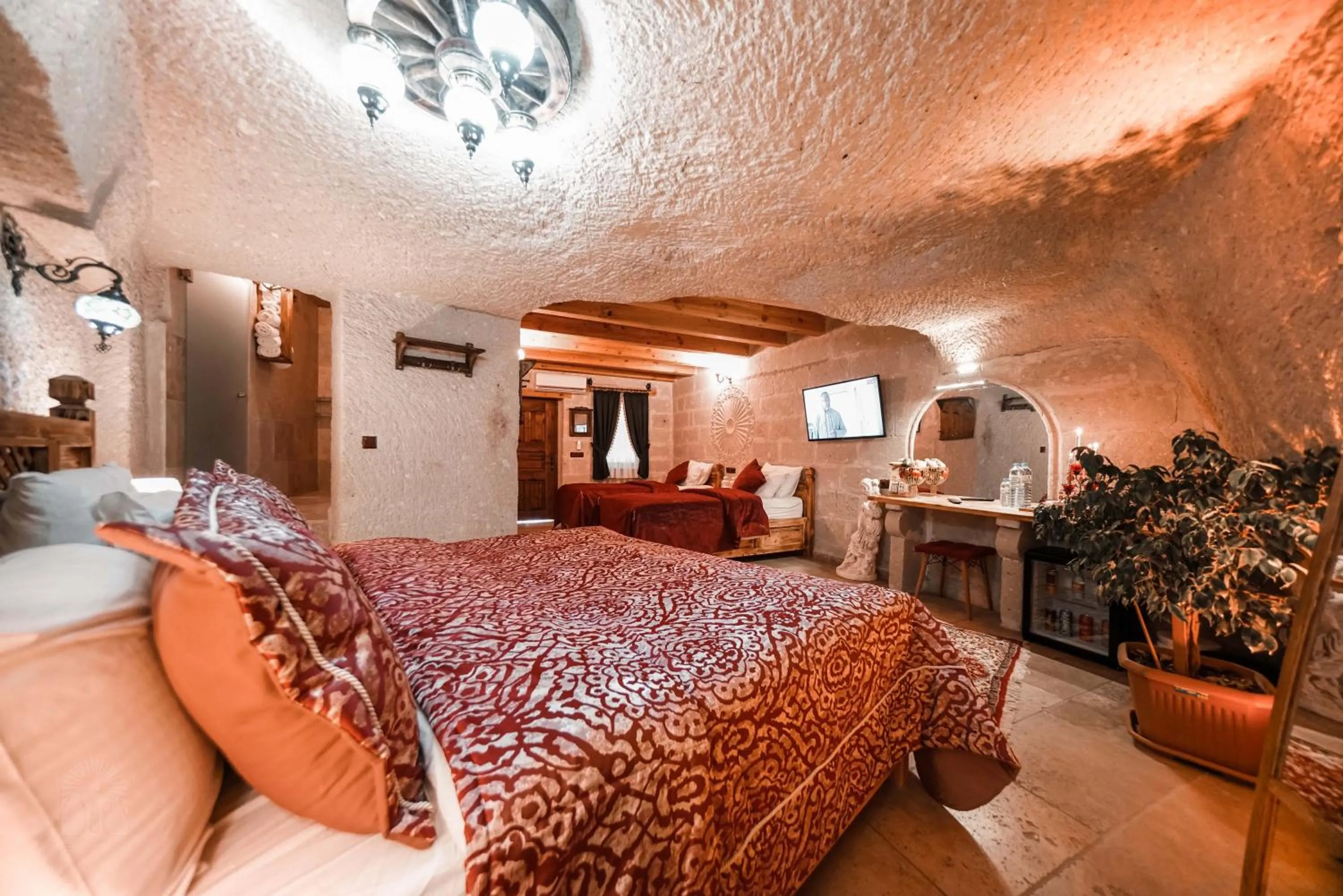 Bed in Zeus Cave Suites