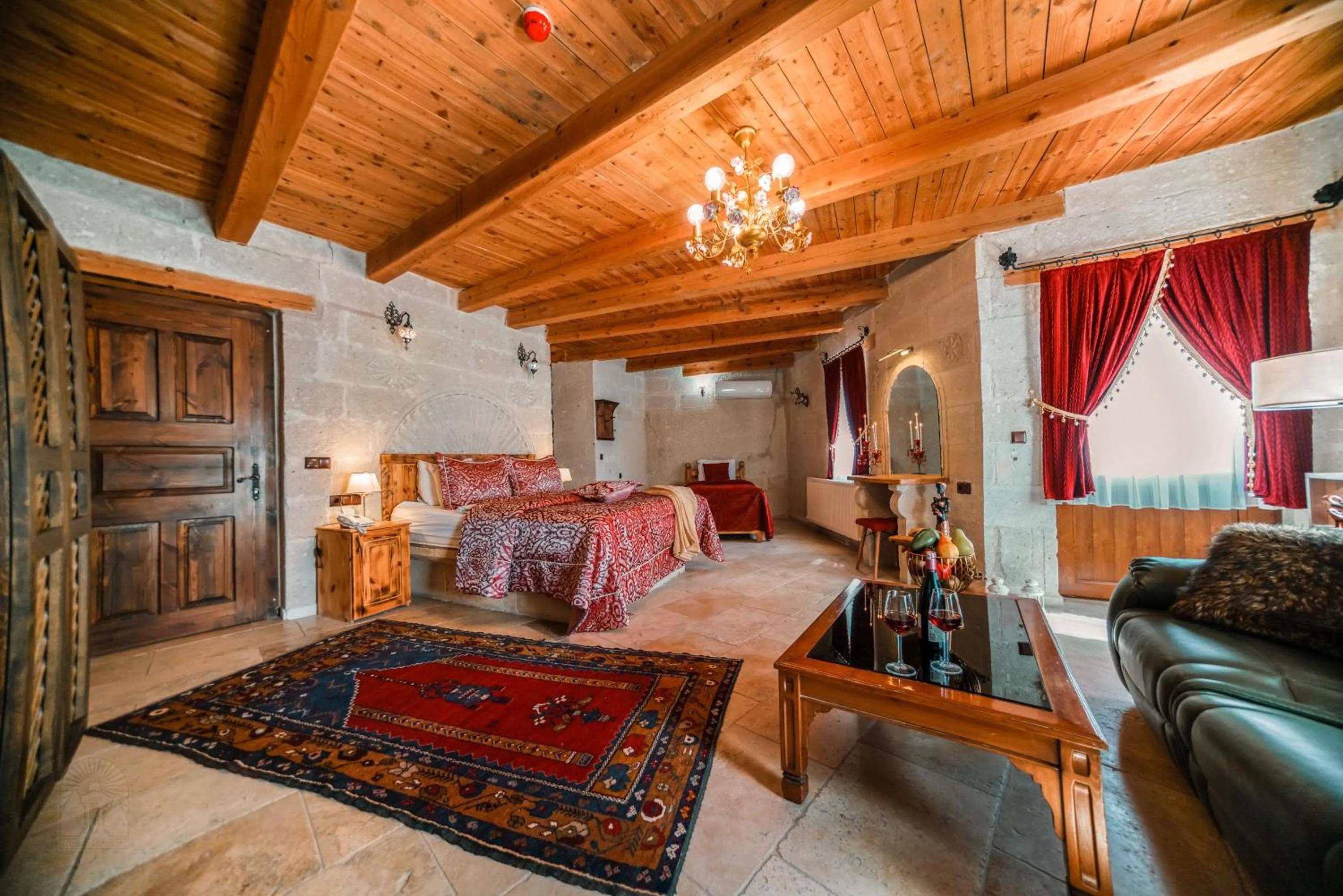 Bed in Zeus Cave Suites