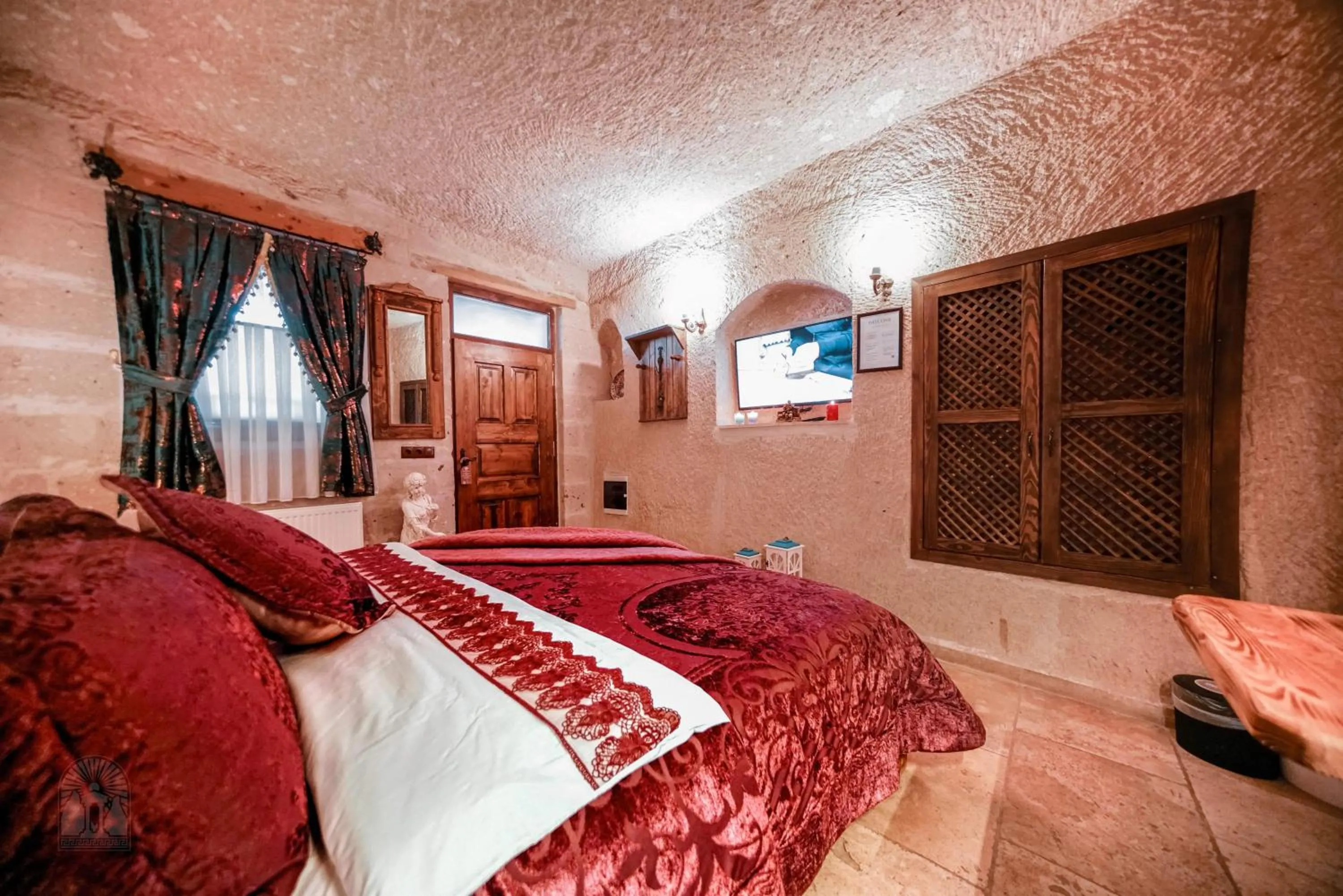 Bed in Zeus Cave Suites