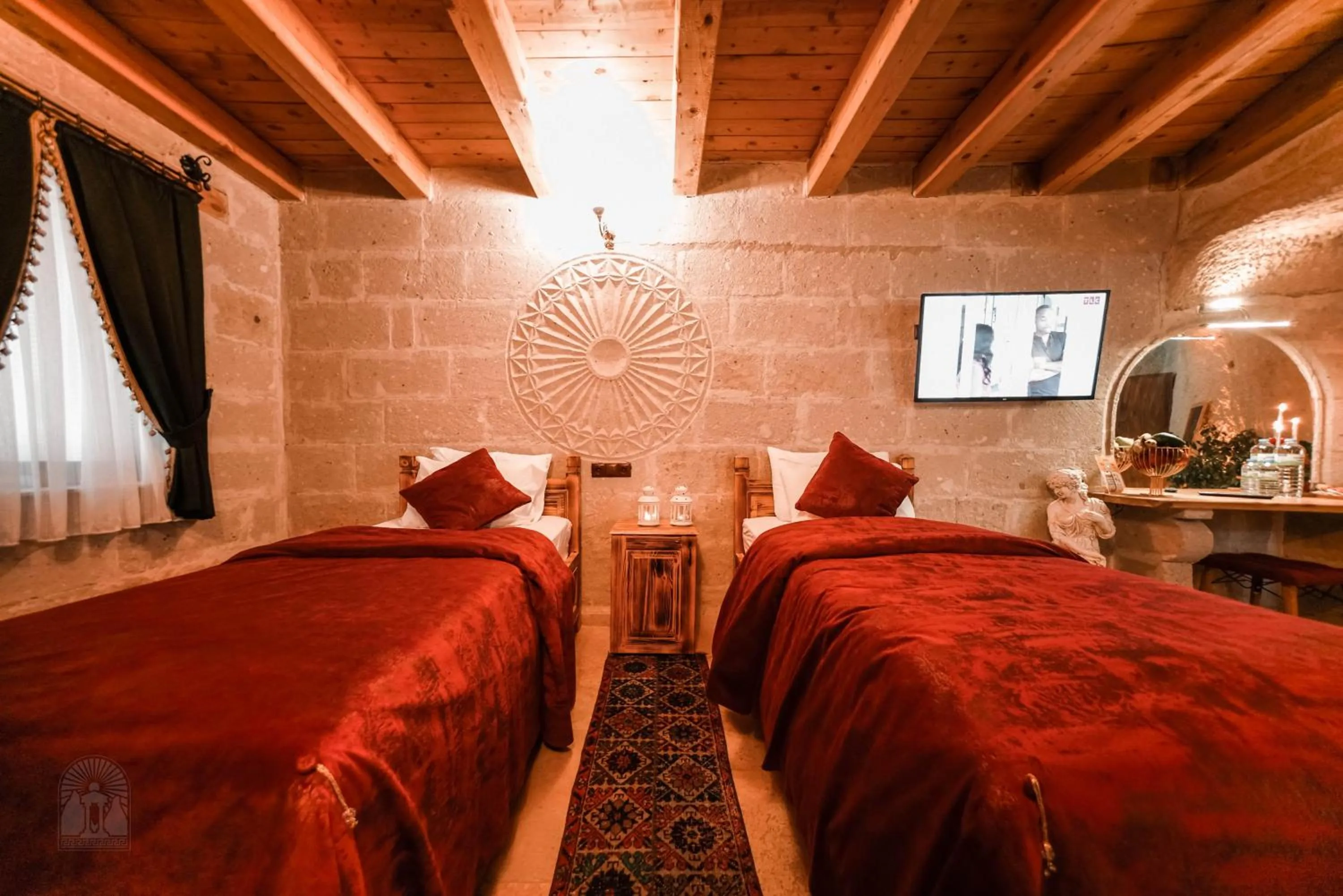 Bed in Zeus Cave Suites