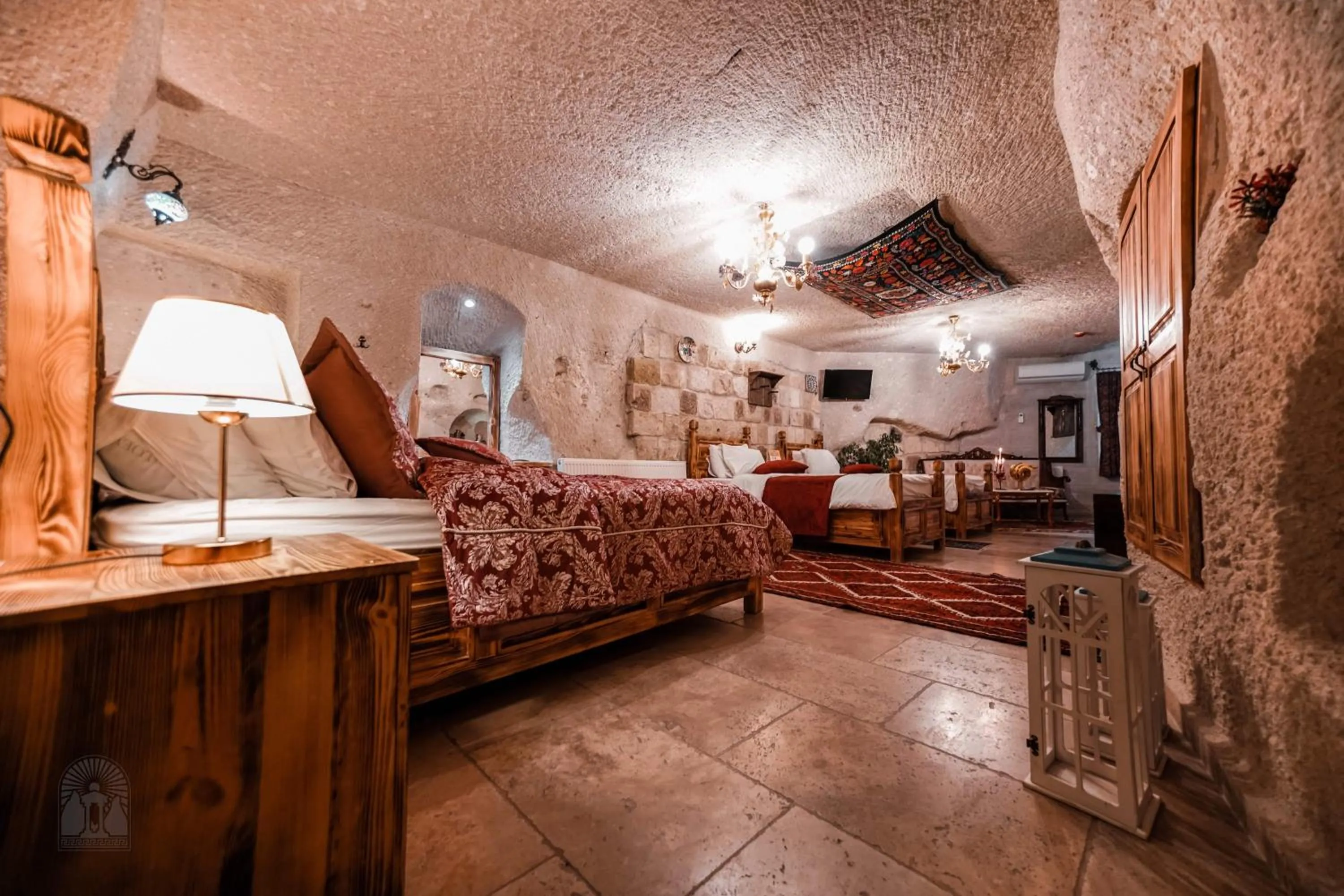 Bed in Zeus Cave Suites