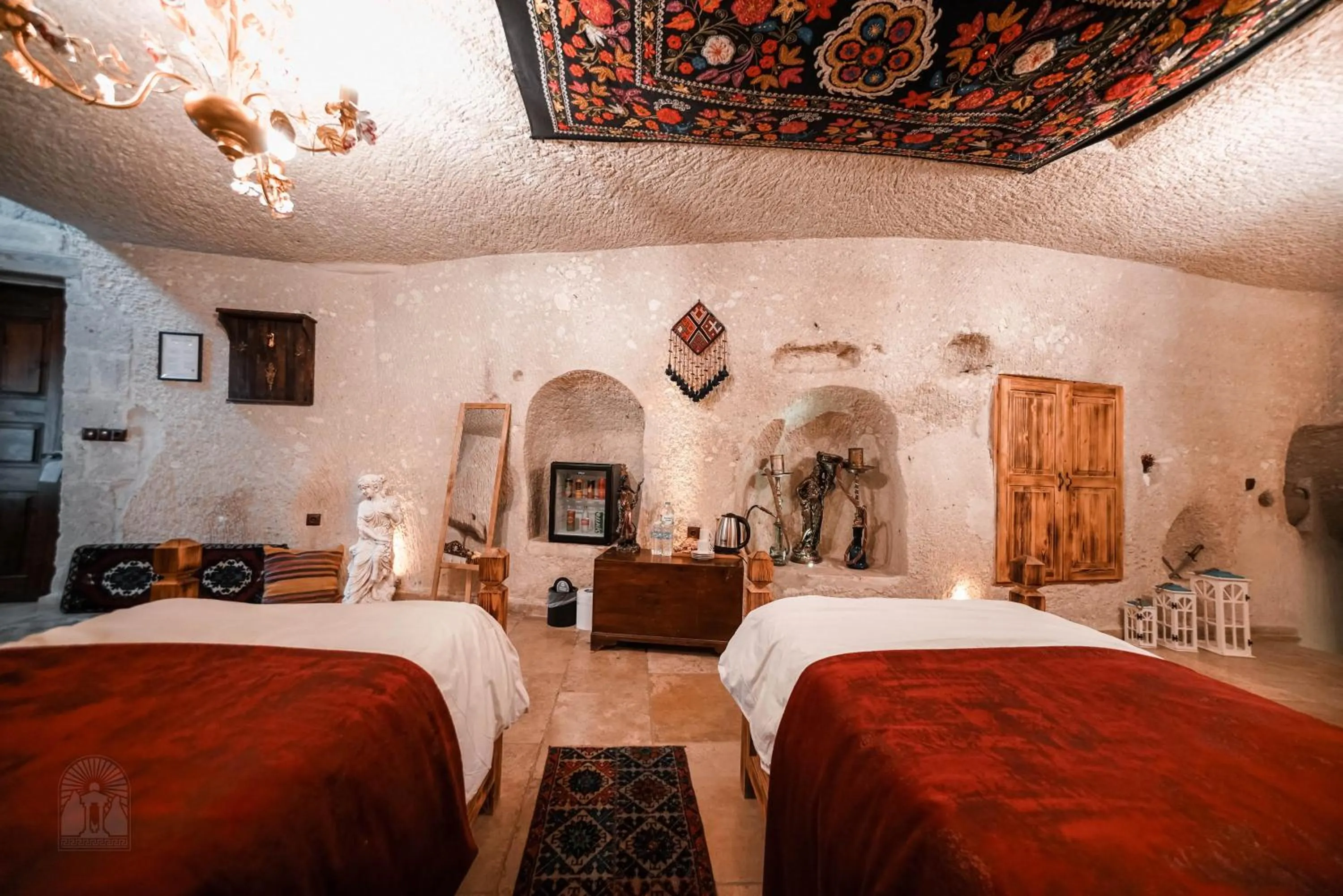 Bed in Zeus Cave Suites