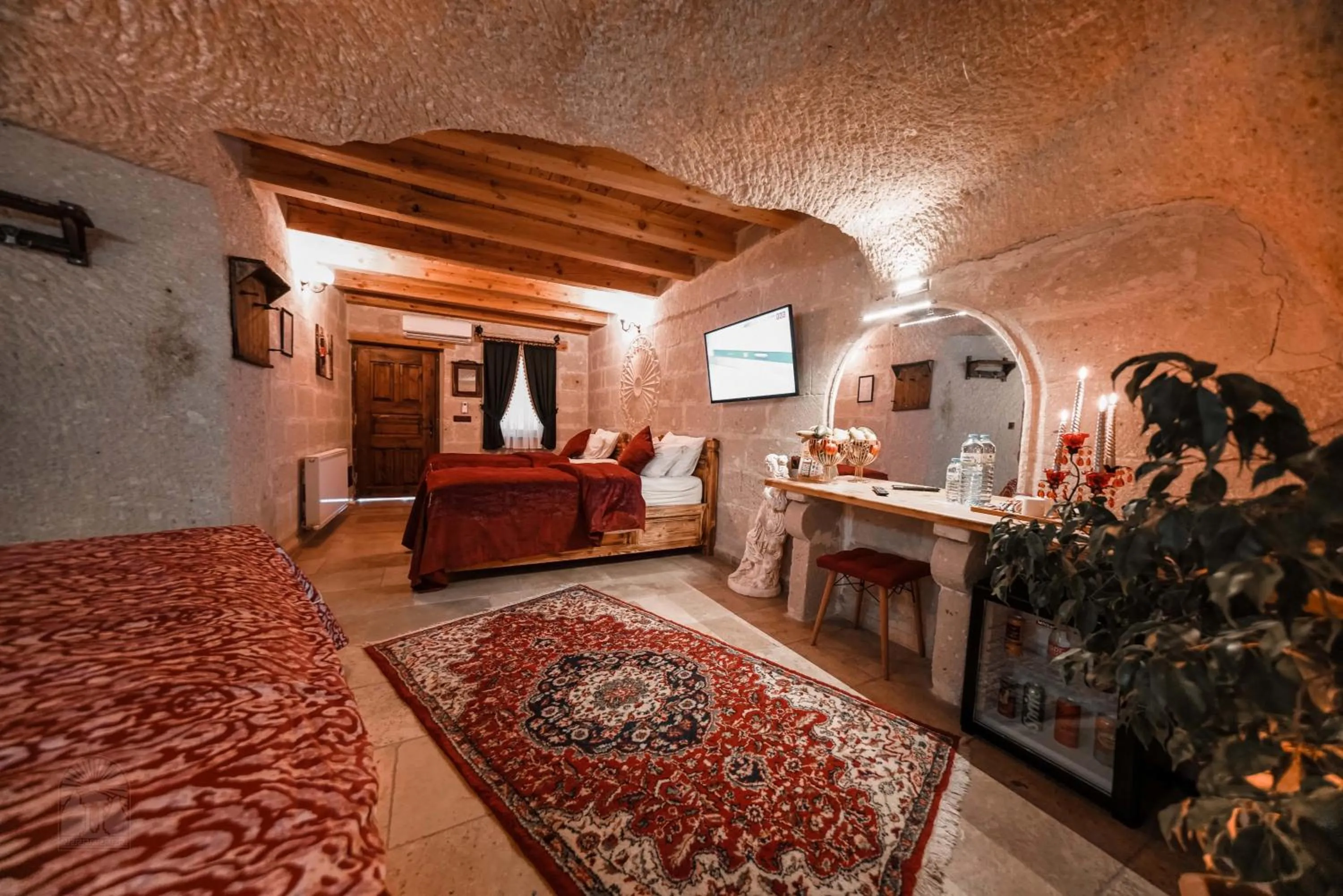 Bed in Zeus Cave Suites