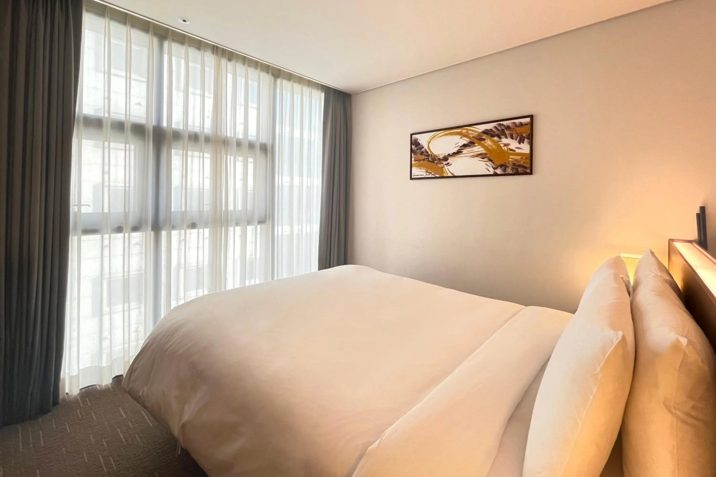 Bed in Ramada Encore by Wyndham Busan Station