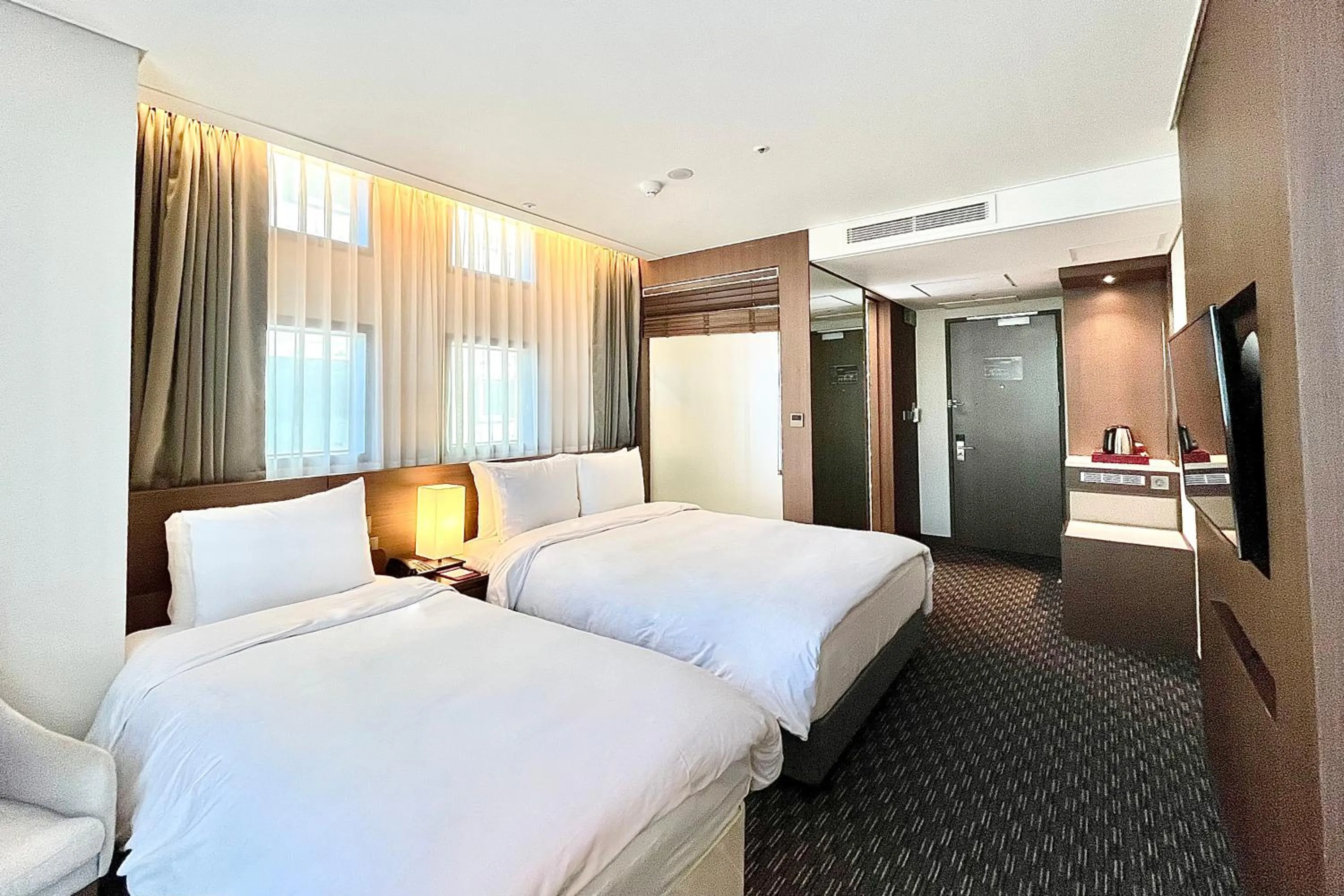 Bed in Ramada Encore by Wyndham Busan Station