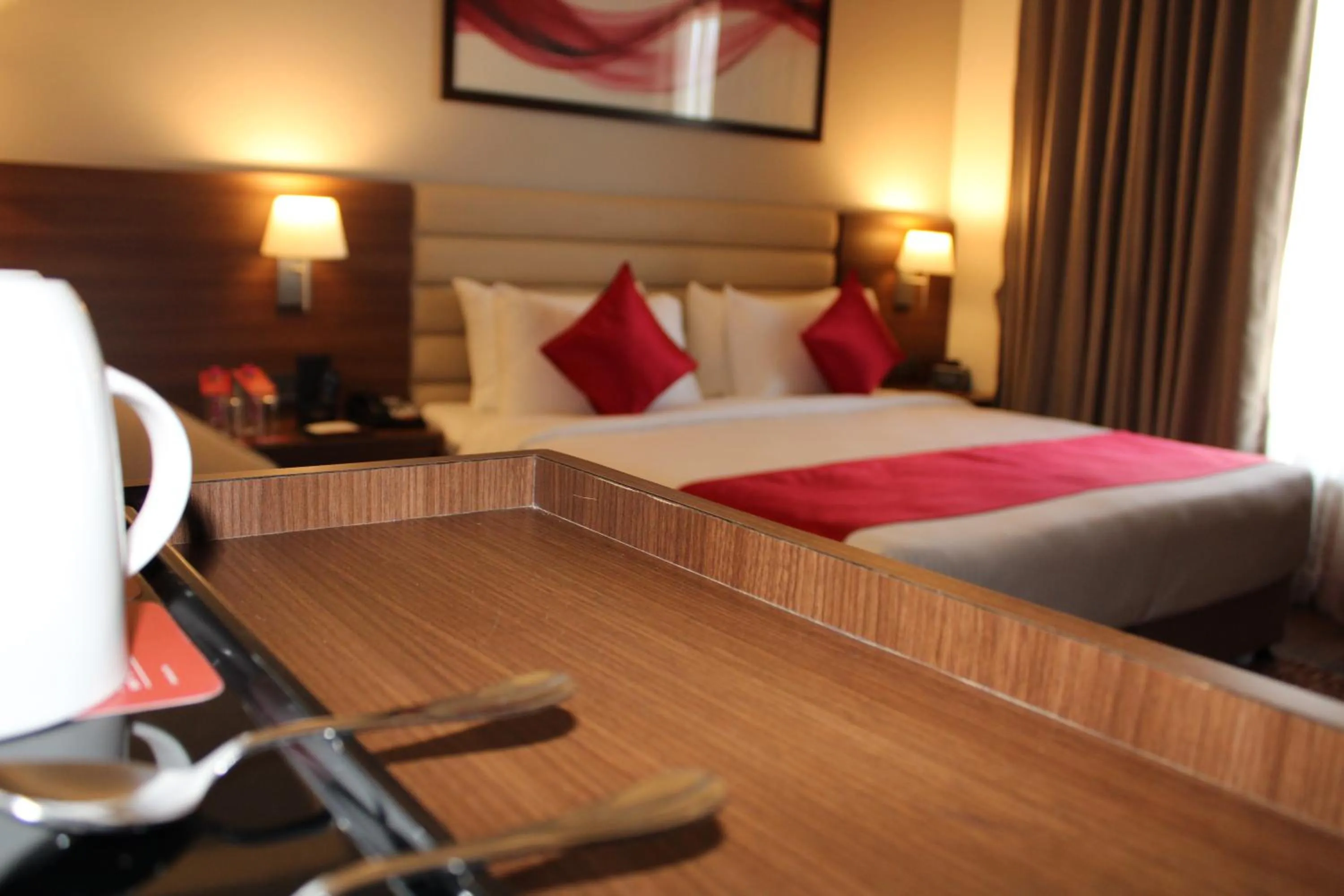 Bedroom, Bed in Ramada by Wyndham Gandhidham Shinay