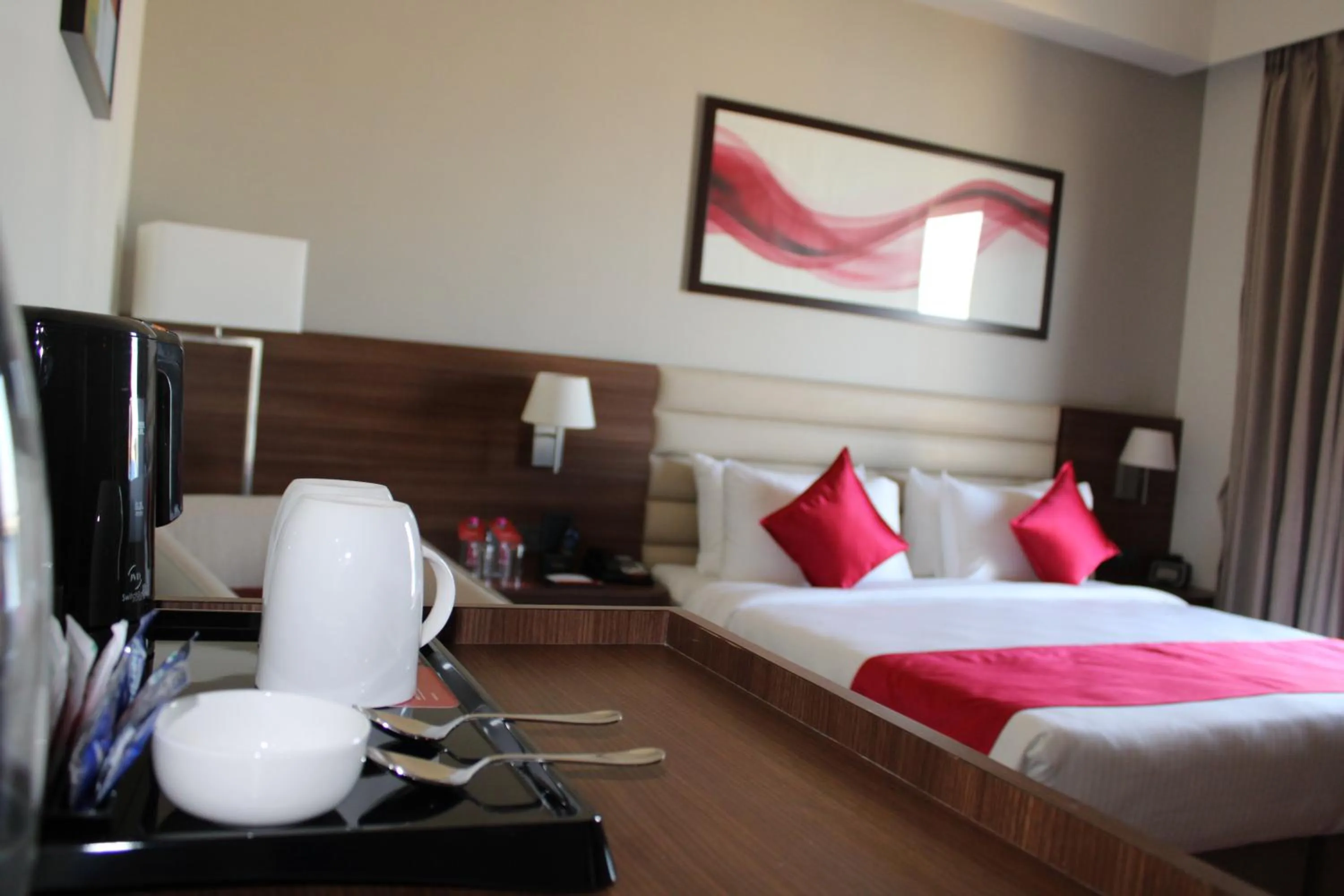 Bedroom, Bed in Ramada by Wyndham Gandhidham Shinay