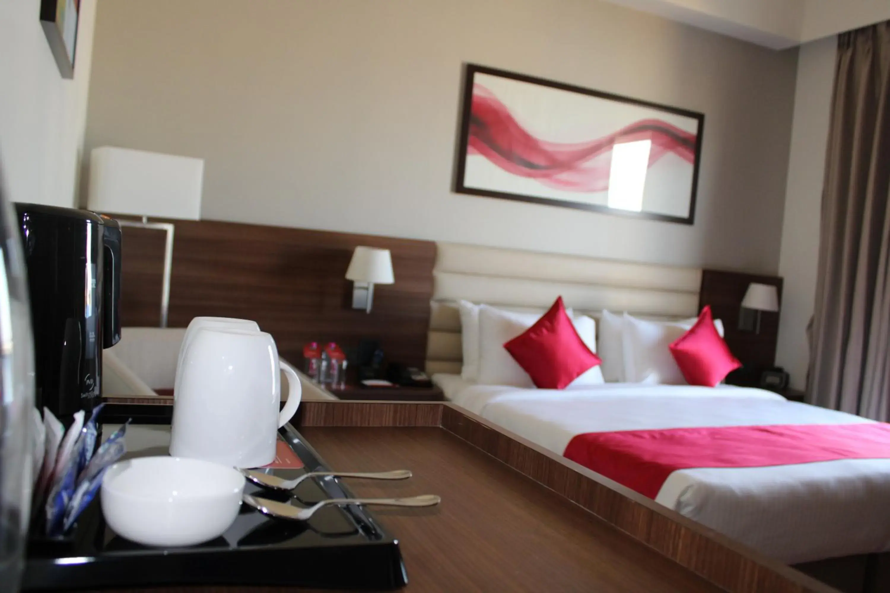 Deluxe King Room (Non-Smoking) - single occupancy - Book & Unlock Exclusive Discounts in Ramada by Wyndham Gandhidham Shinay Deluxe King Room (Non-Smoking) - single occupancy - Book & Unlock Exclusive Discounts in Ramada by Wyndham Gandhidham Shinay