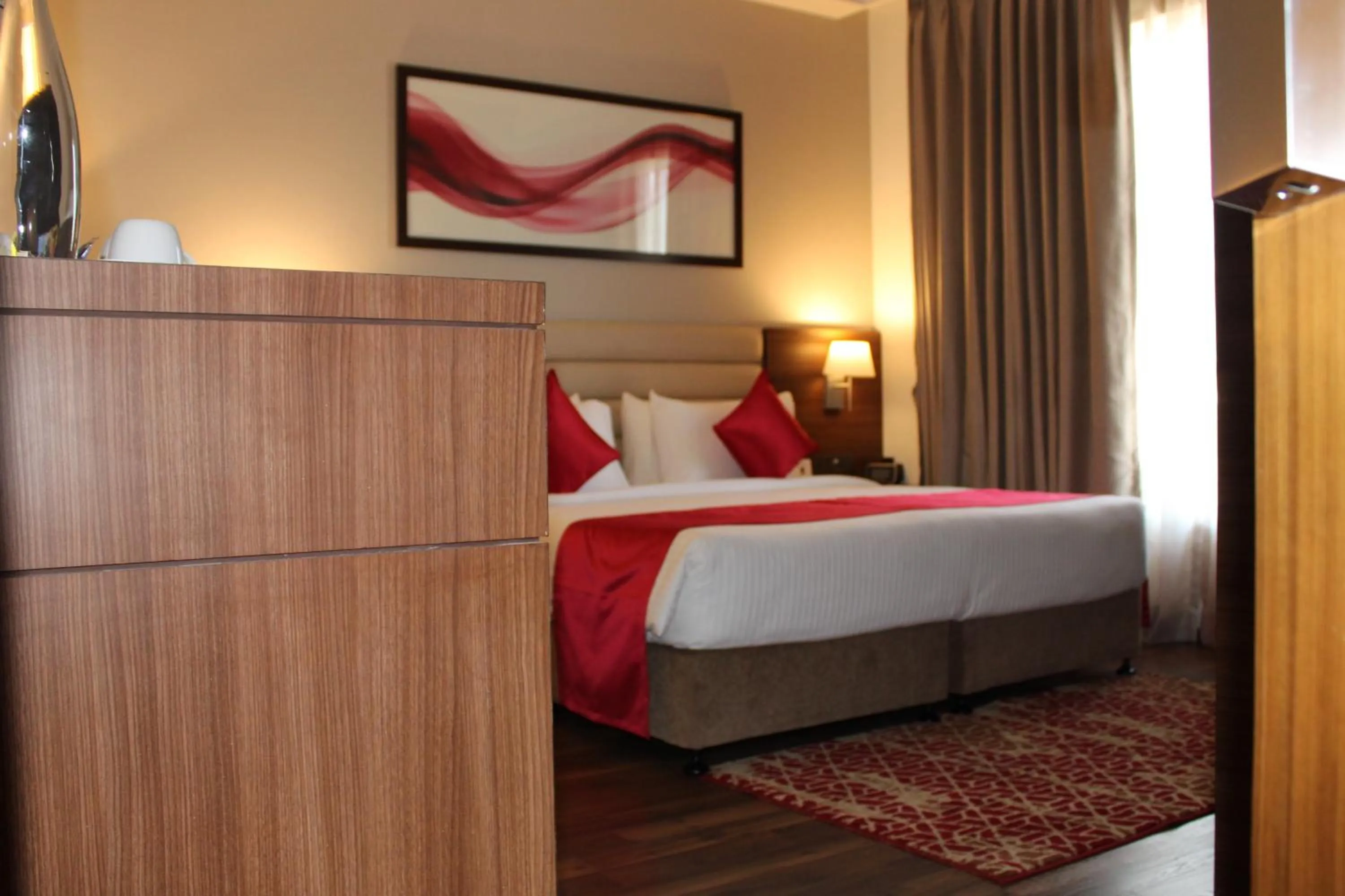Bedroom, Bed in Ramada by Wyndham Gandhidham Shinay