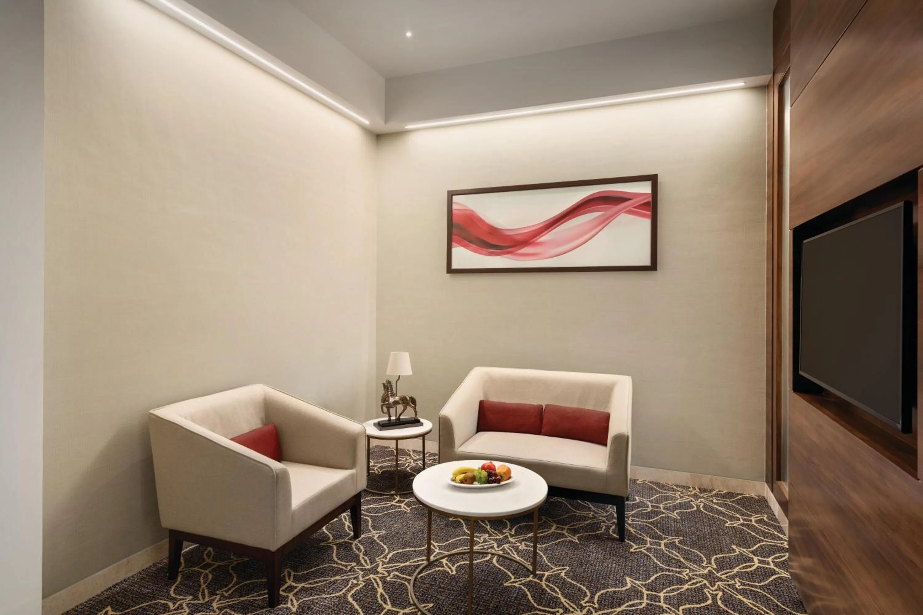 Living room in Ramada by Wyndham Gandhidham Shinay