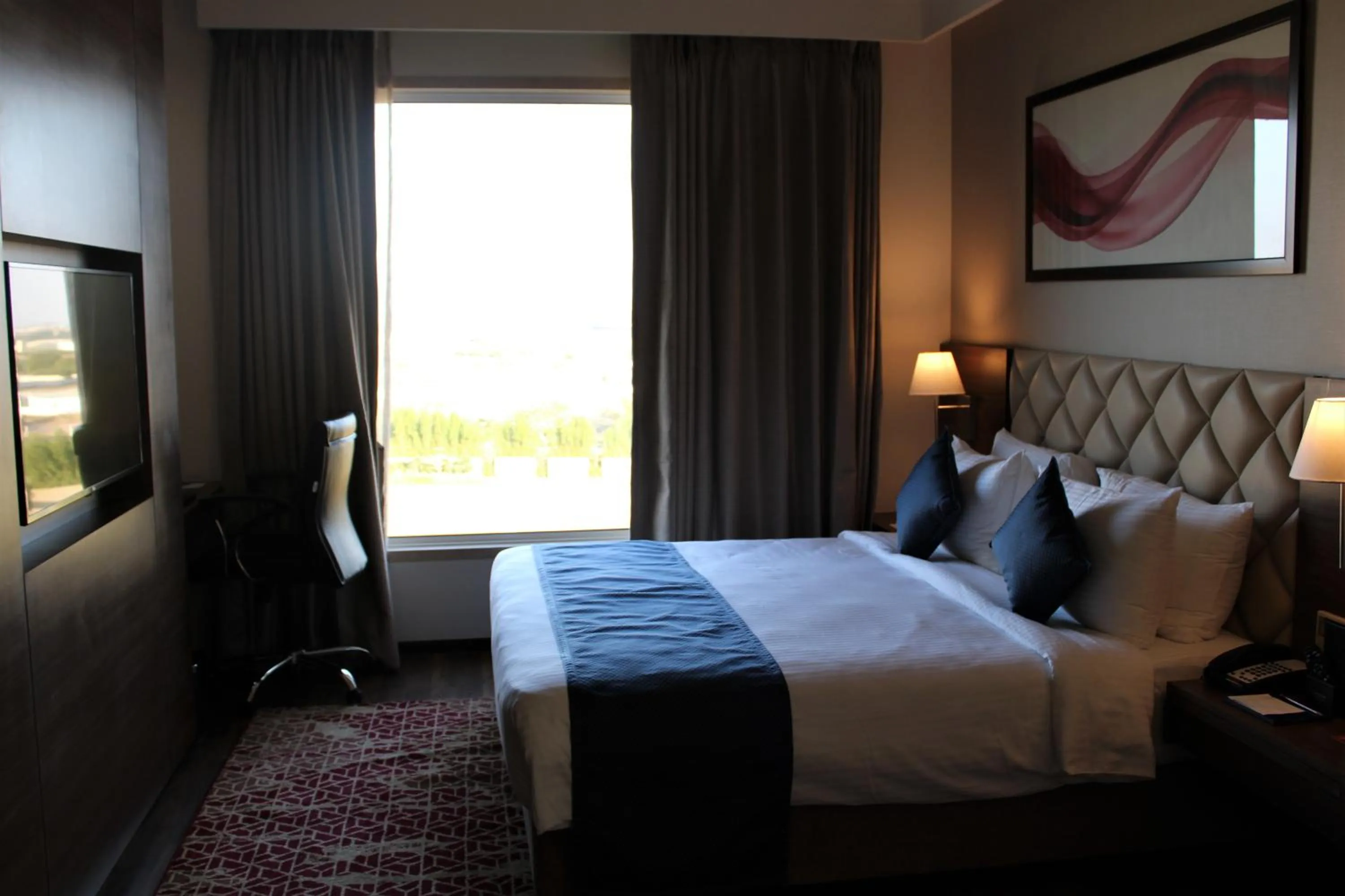 Bedroom, Bed in Ramada by Wyndham Gandhidham Shinay