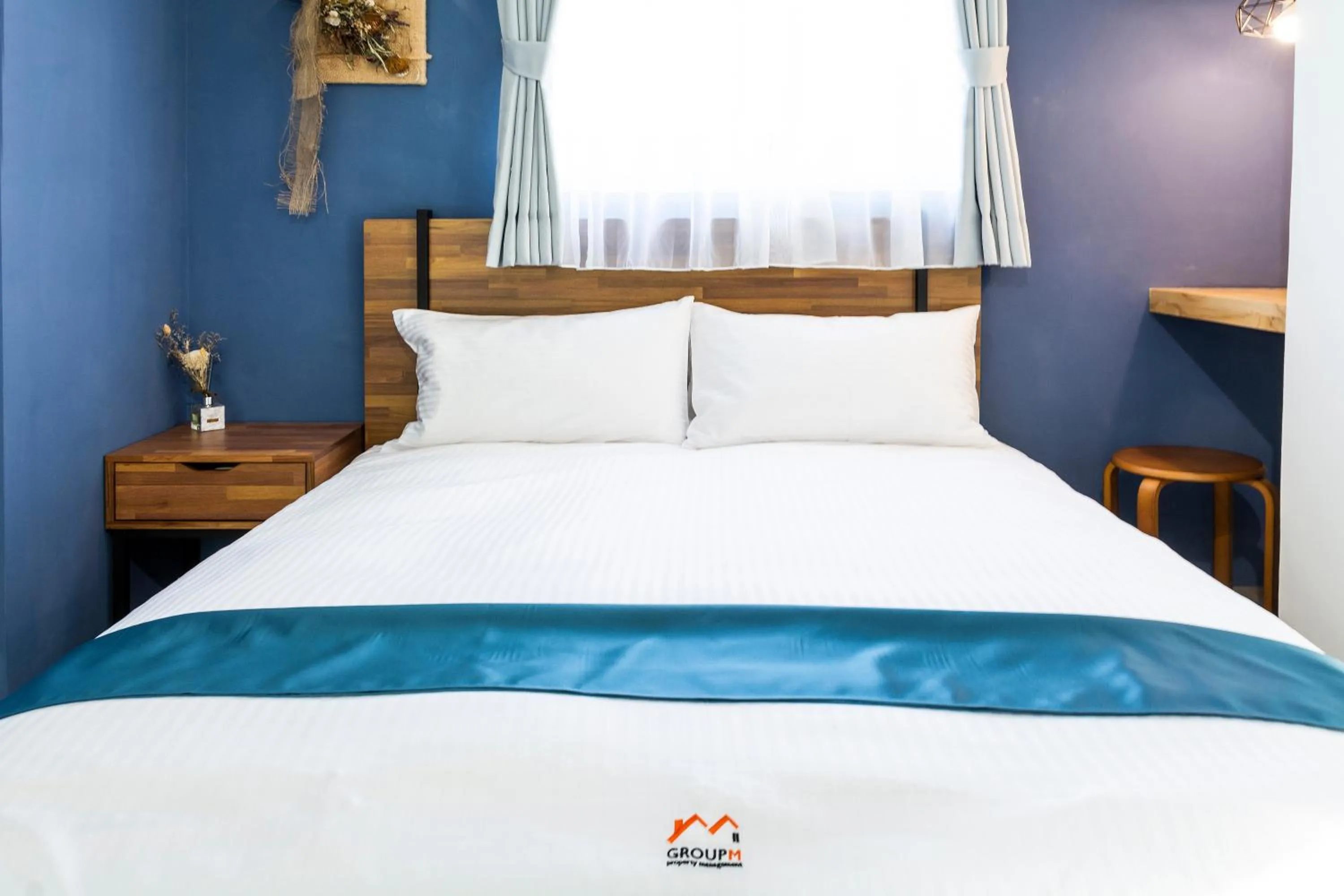 Bed in 沐藍輕旅 Mulan Light Inn I 海安路住宿