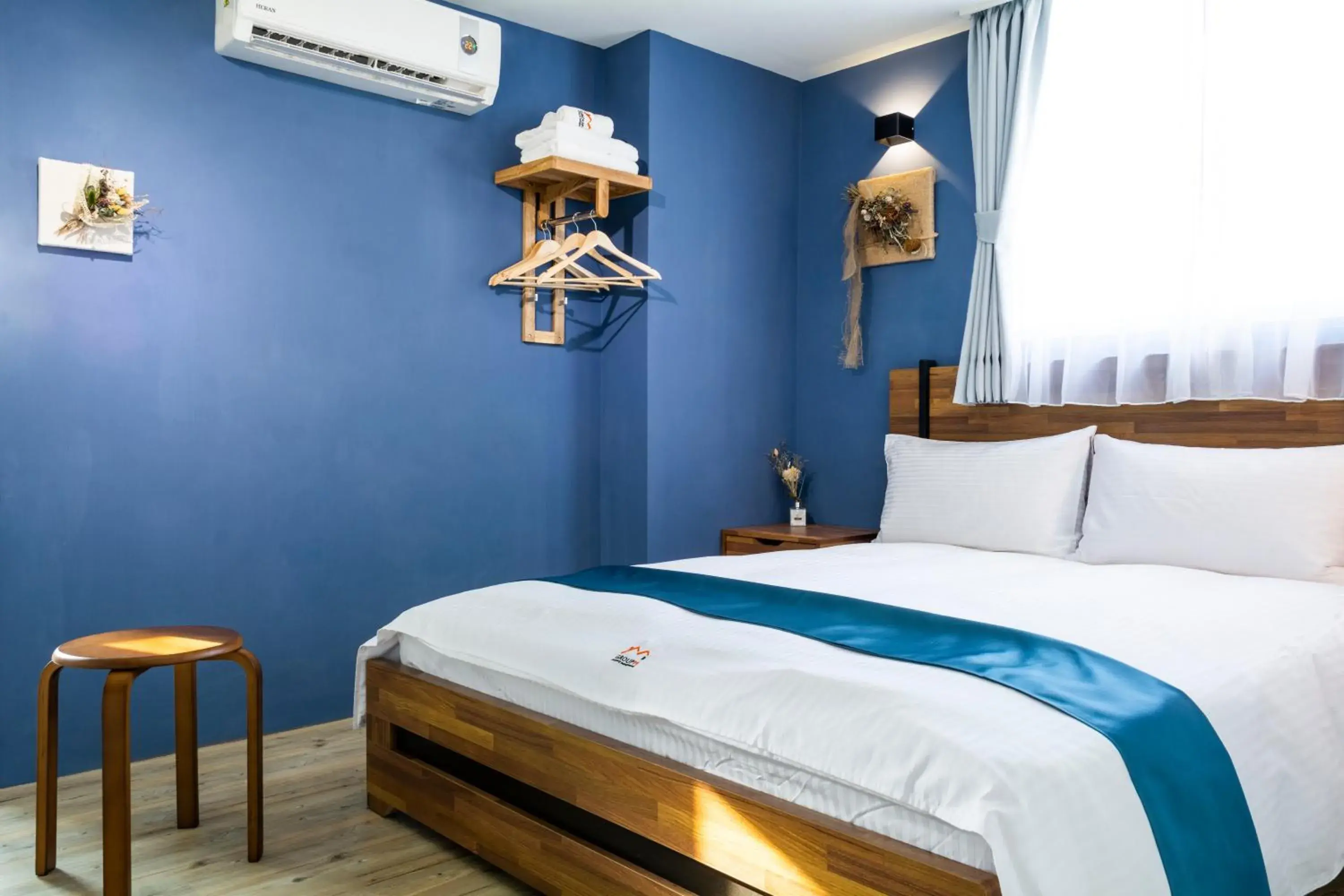 Bed in 沐藍輕旅 Mulan Light Inn I 海安路住宿 Bed in 沐藍輕旅 Mulan Light Inn I 海安路住宿