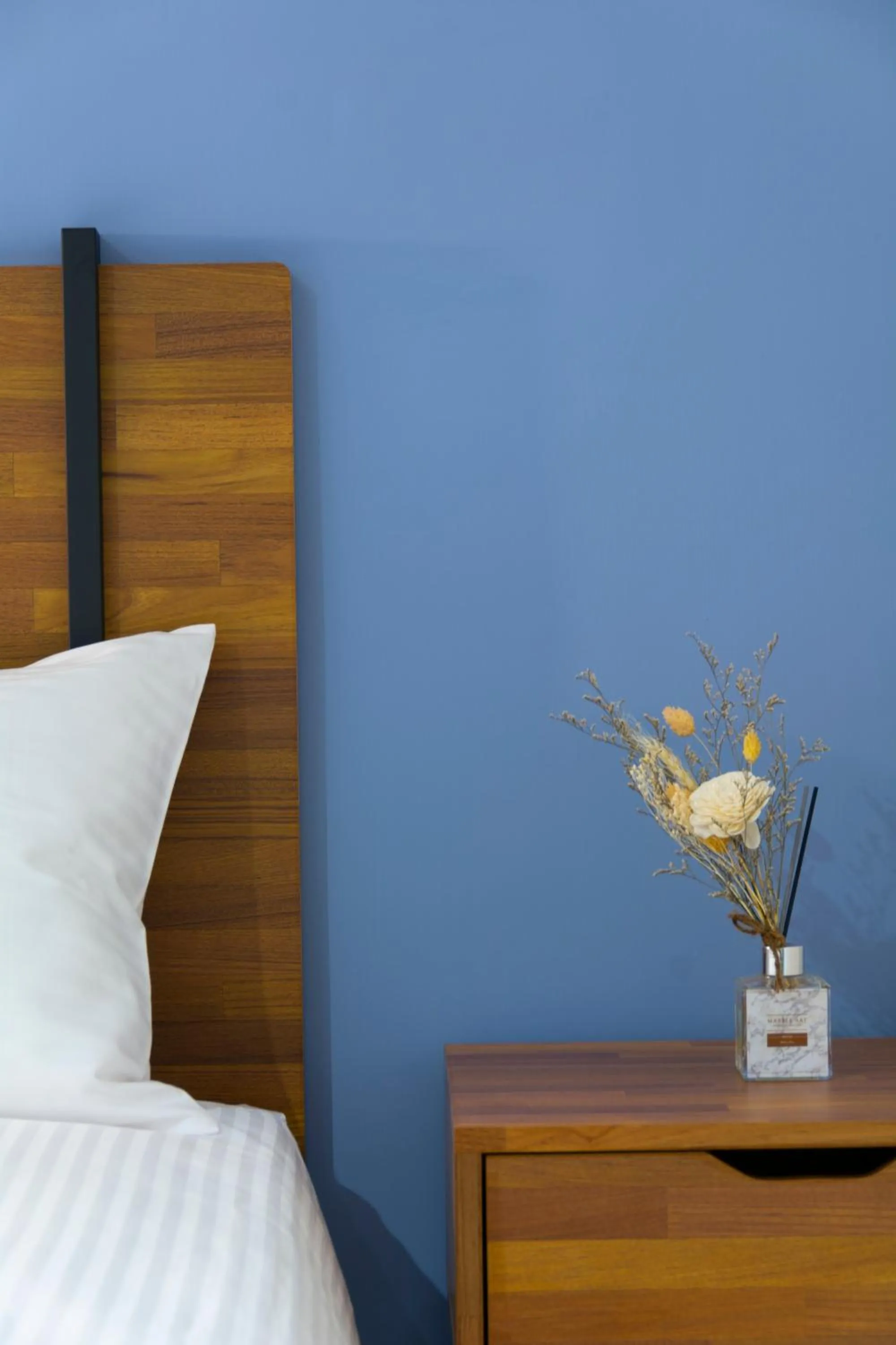 Bed in 沐藍輕旅 Mulan Light Inn I 海安路住宿