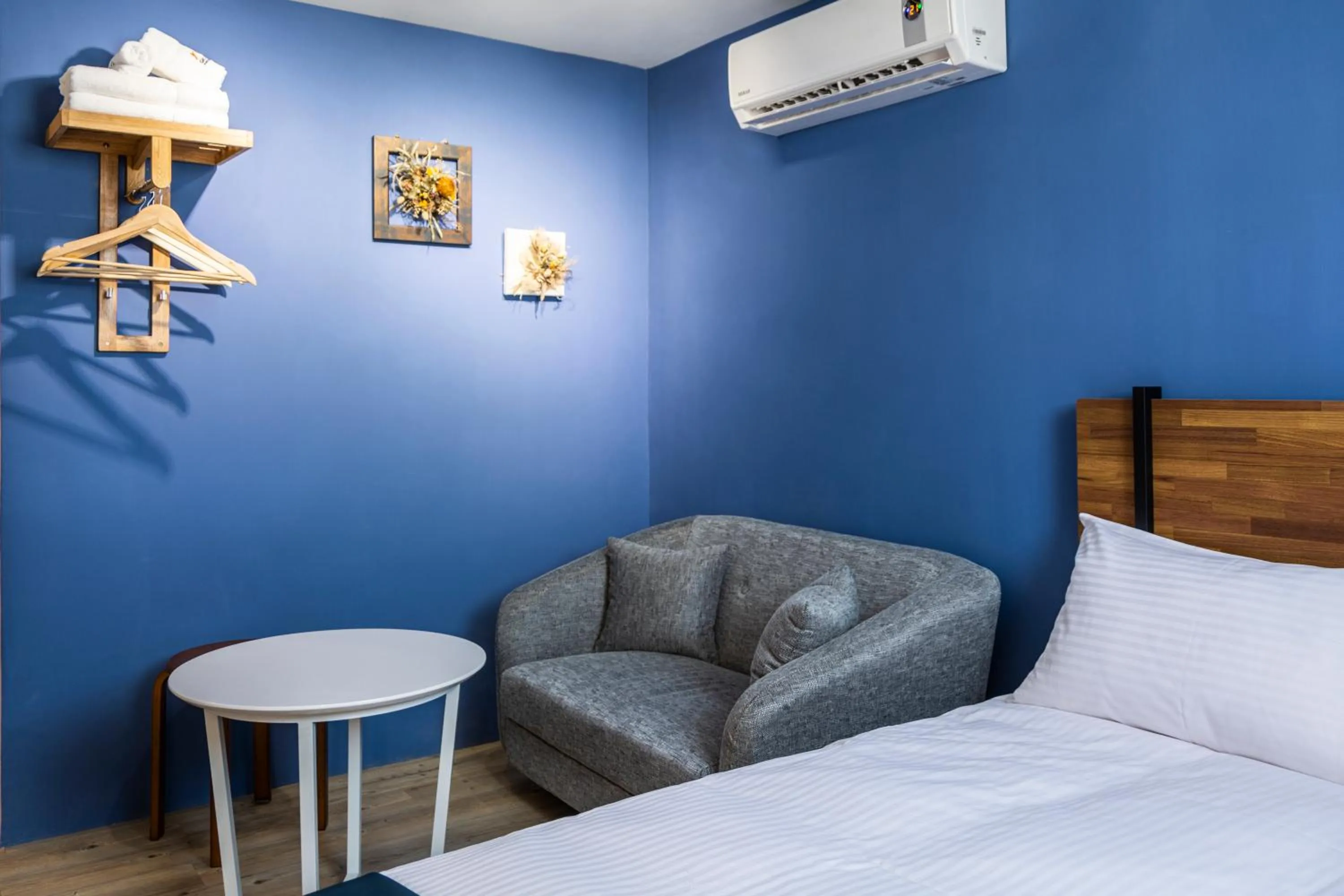 Bed in 沐藍輕旅 Mulan Light Inn I 海安路住宿