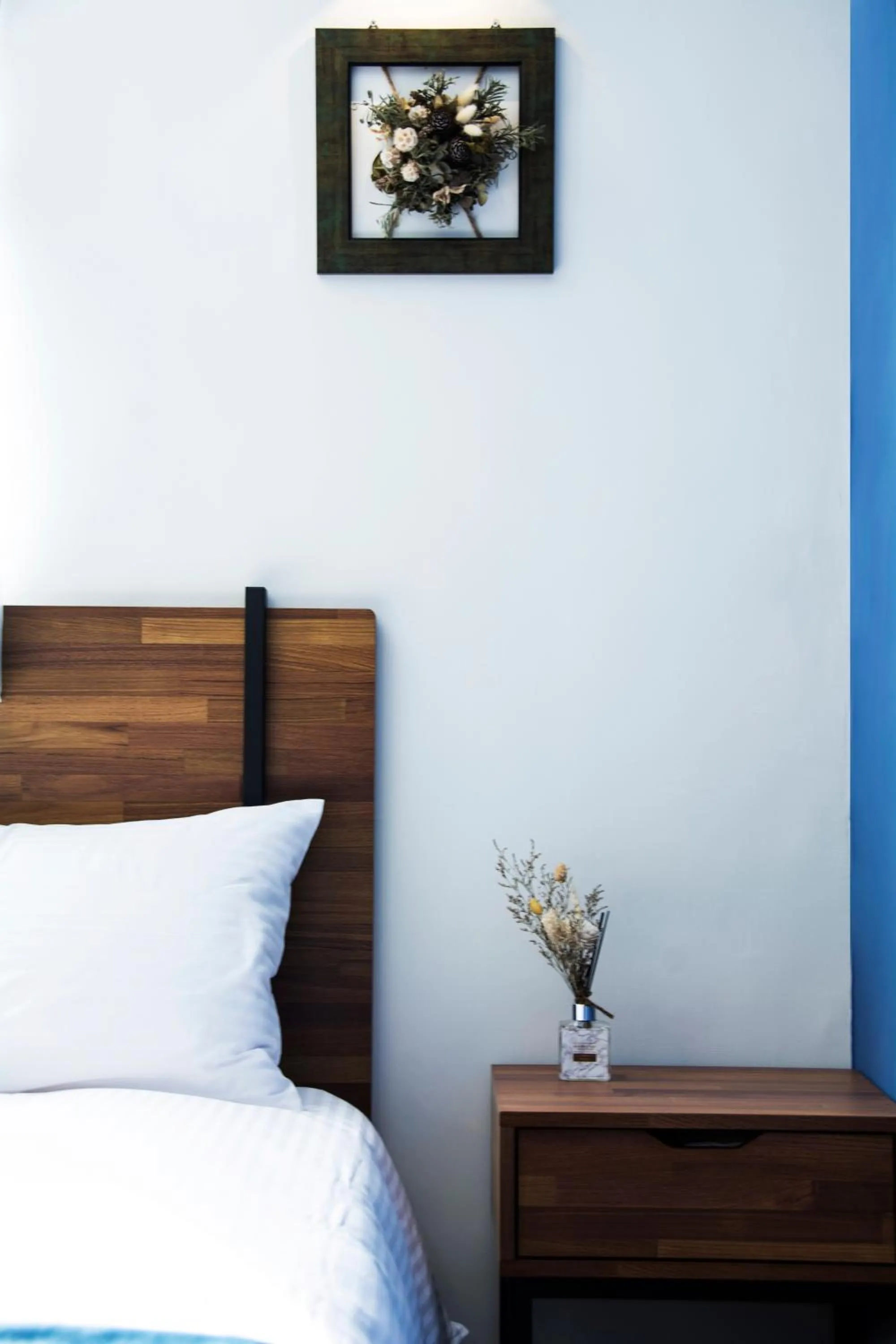 Bed in 沐藍輕旅 Mulan Light Inn I 海安路住宿