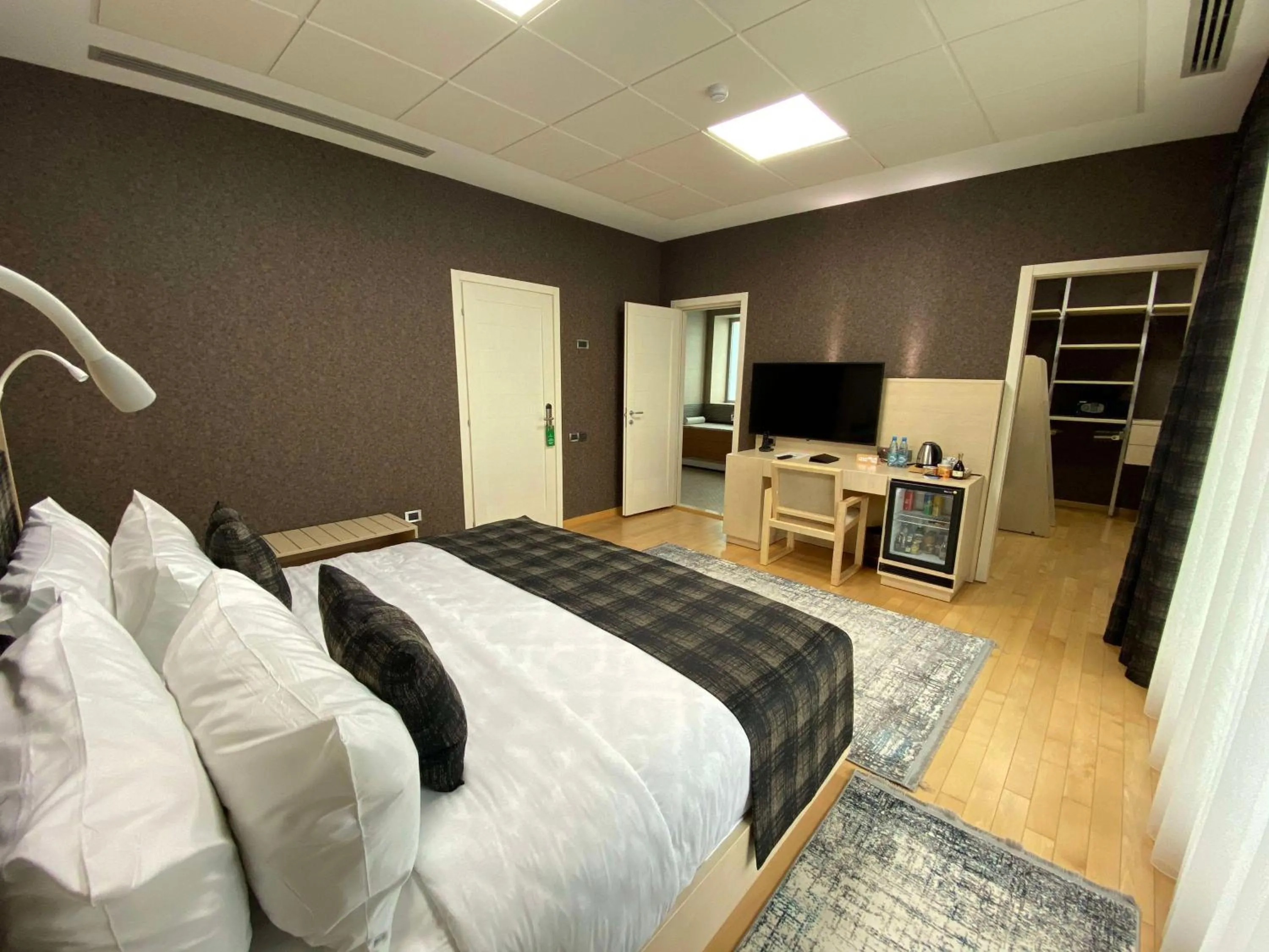 Communal lounge/ TV room, Bed in Badam d'Art Boutique Hotel