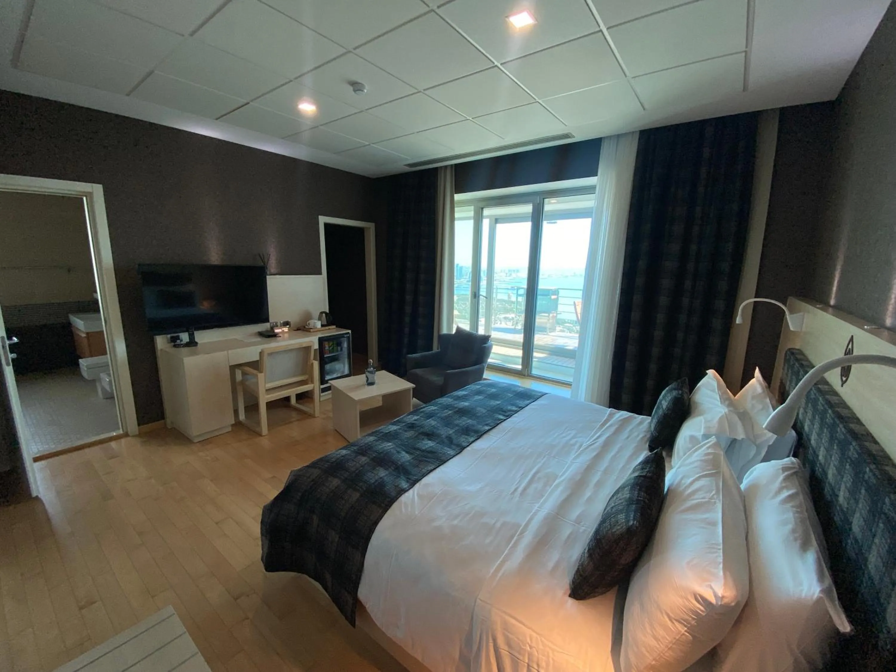 Communal lounge/ TV room, Bed in Badam d'Art Boutique Hotel