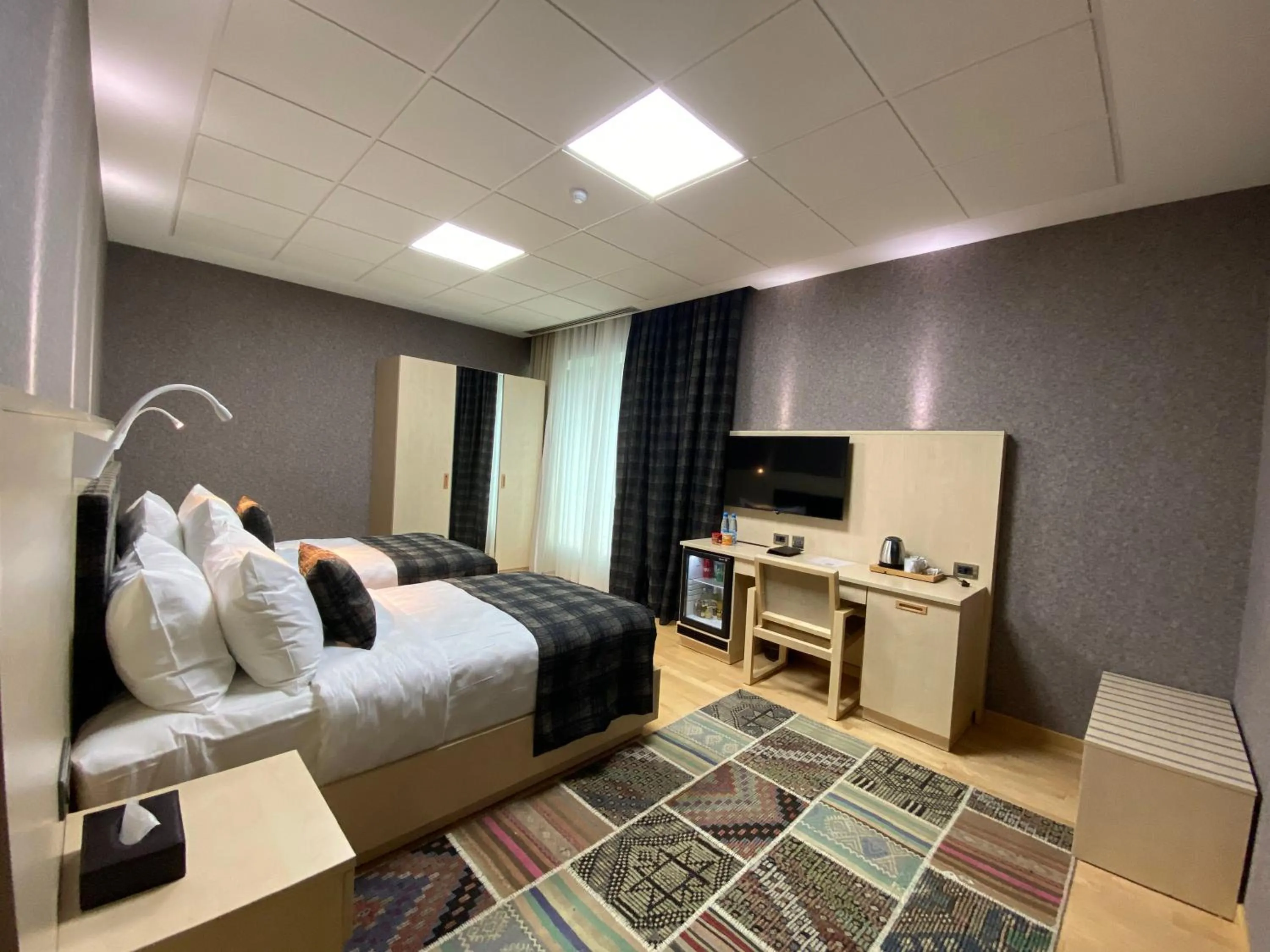 Communal lounge/ TV room, Bed in Badam d'Art Boutique Hotel