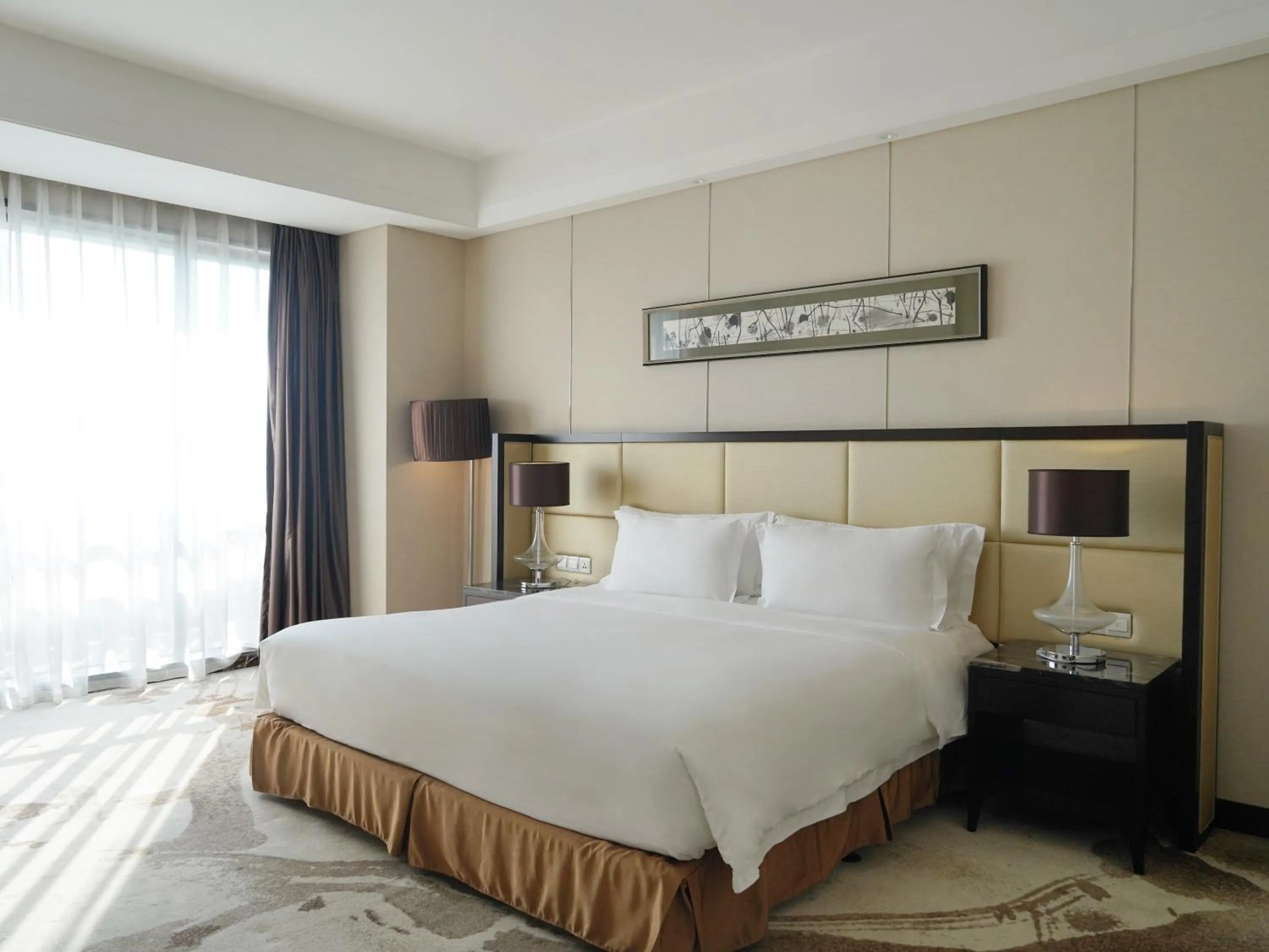 Bed in Howard Johnson Changsheng Plaza Meizhou