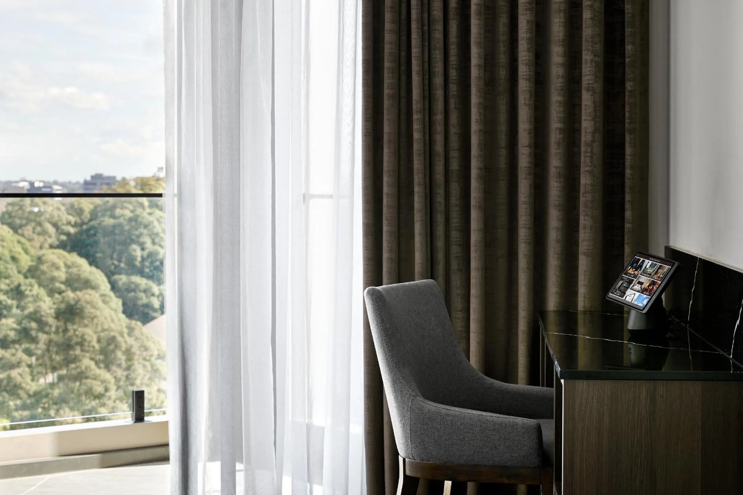 Communal lounge/ TV room in Crowne Plaza Sydney Burwood by IHG