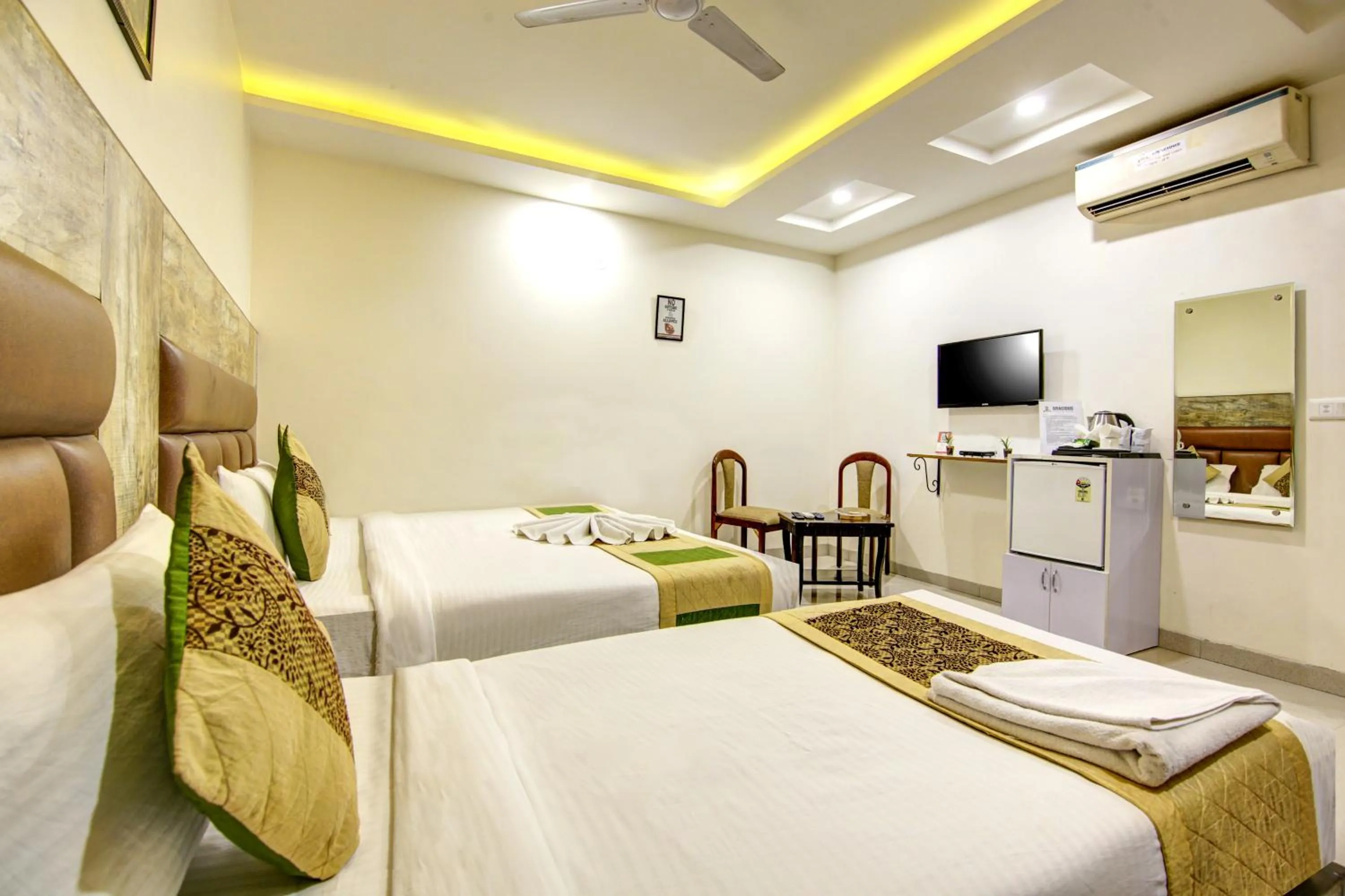 Bedroom, Bed in Gracious by Vishesh Hotels & Home Stay
