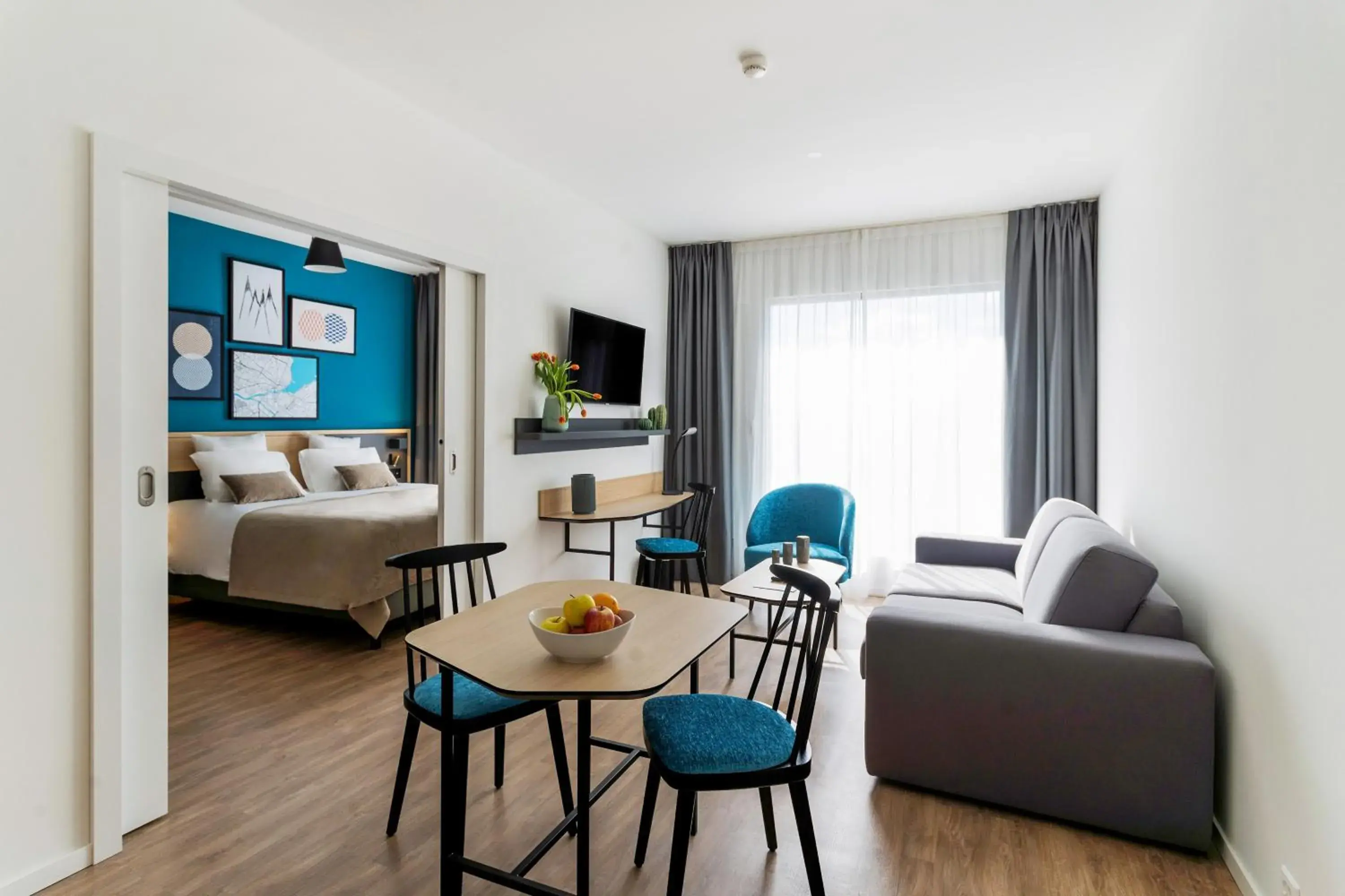 Living room, Bed in Appart'City Collection Genève Aéroport - Vernier Living room, Bed in Appart'City Collection Genève Aéroport - Vernier