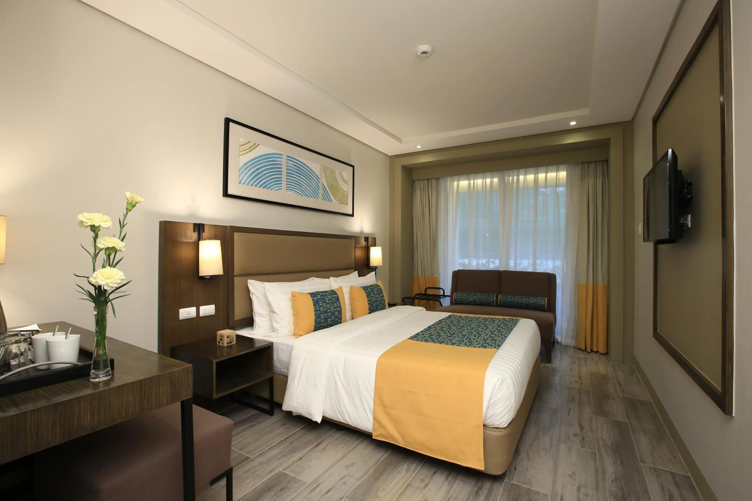 Photo of the whole room, Bed in Belmont Hotel Boracay near Newcoast Beach