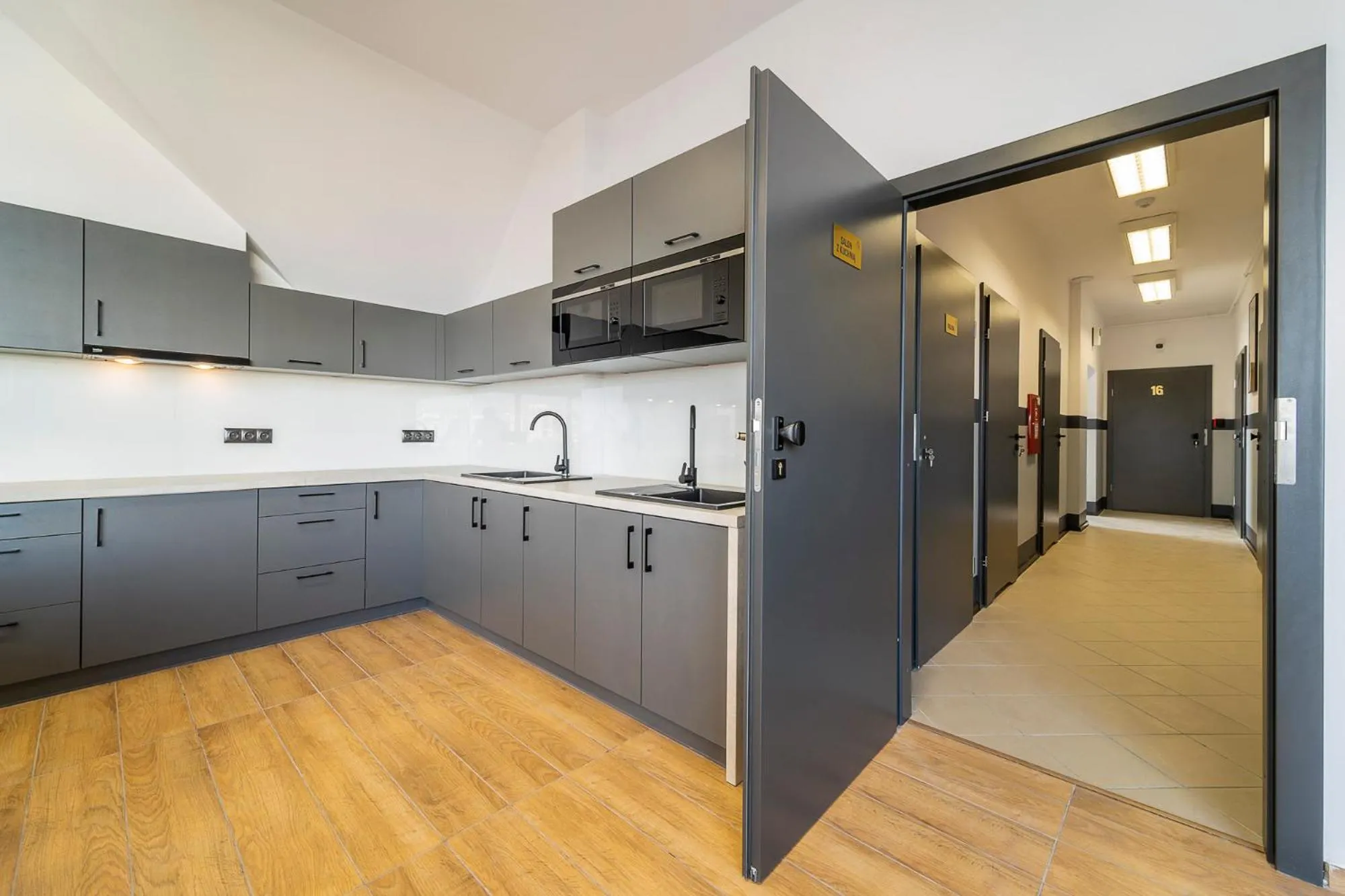 Communal kitchen in Gems Hostel