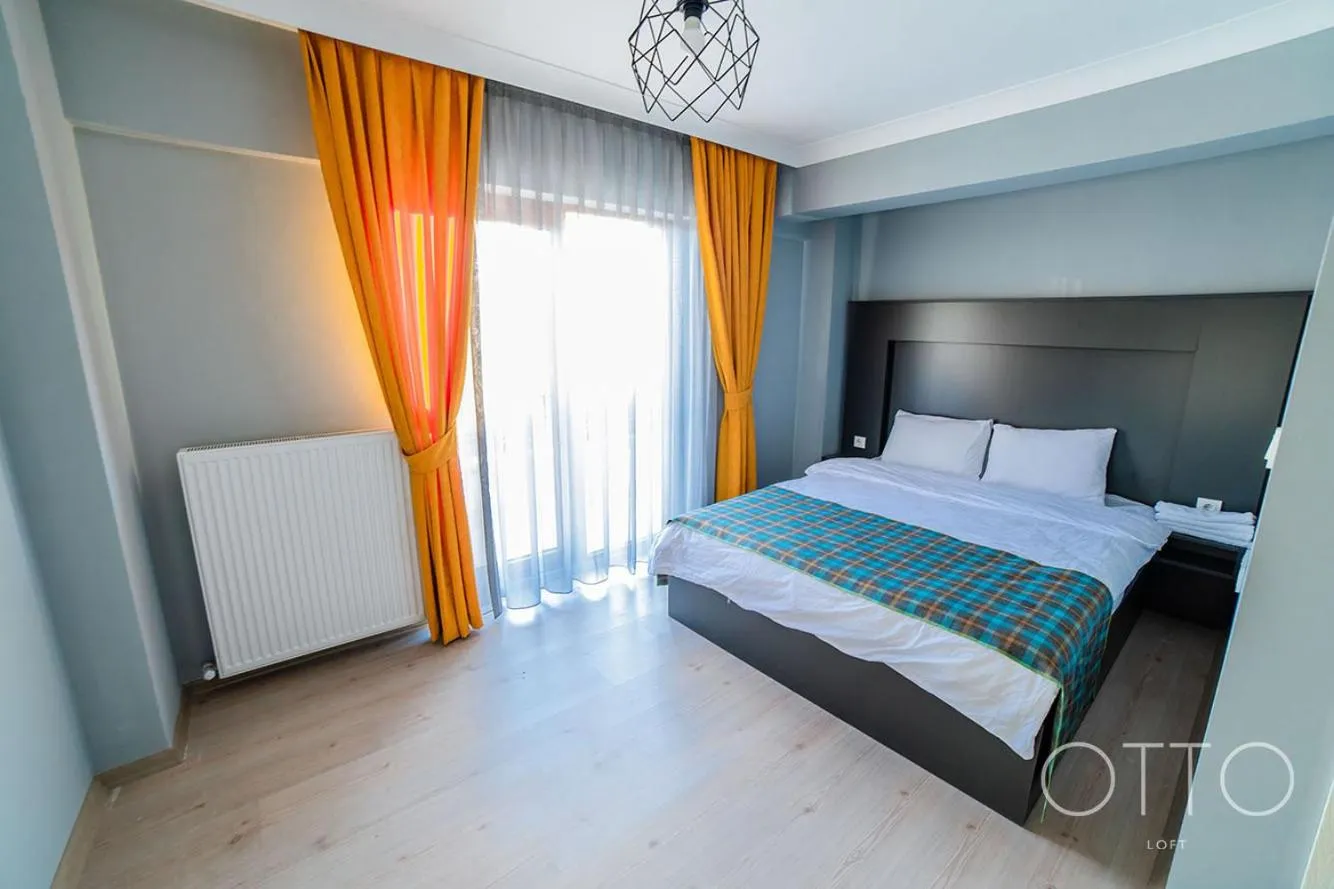 Bed in OTTO LOFT Premium Apartments