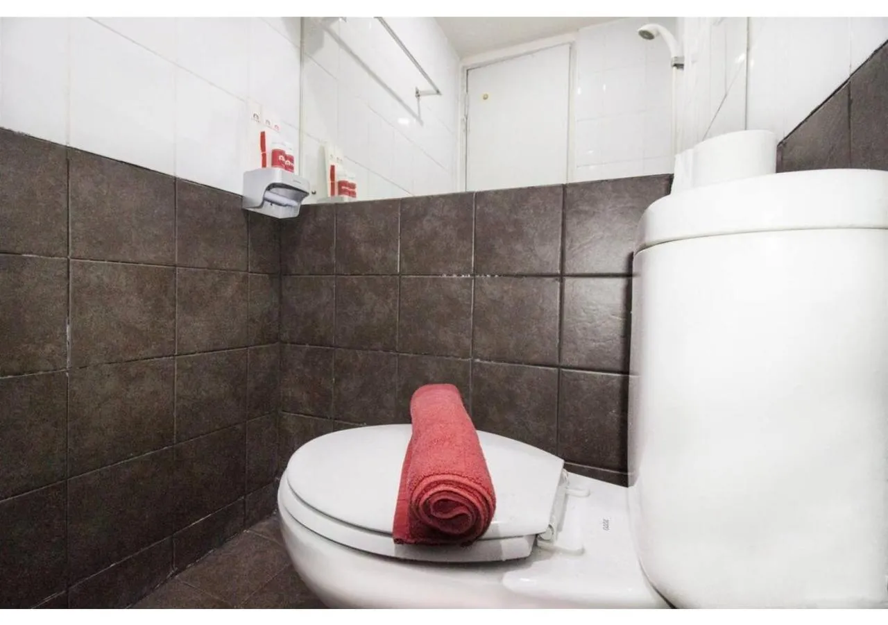 Bathroom in Apartment Green Pramuka by Vincent