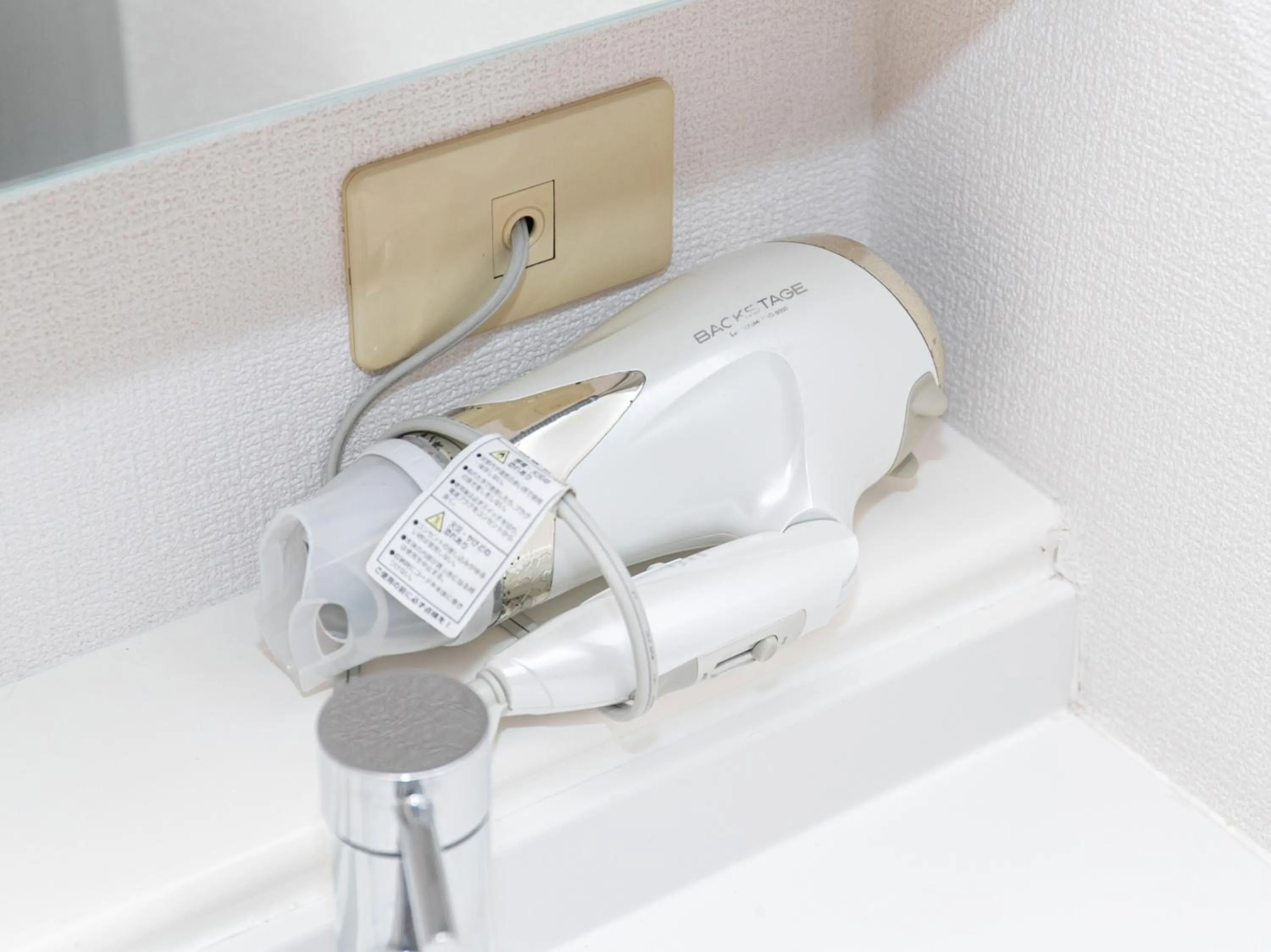 hair dryier in Tabist New World Hotel Kagoshima Kanoya