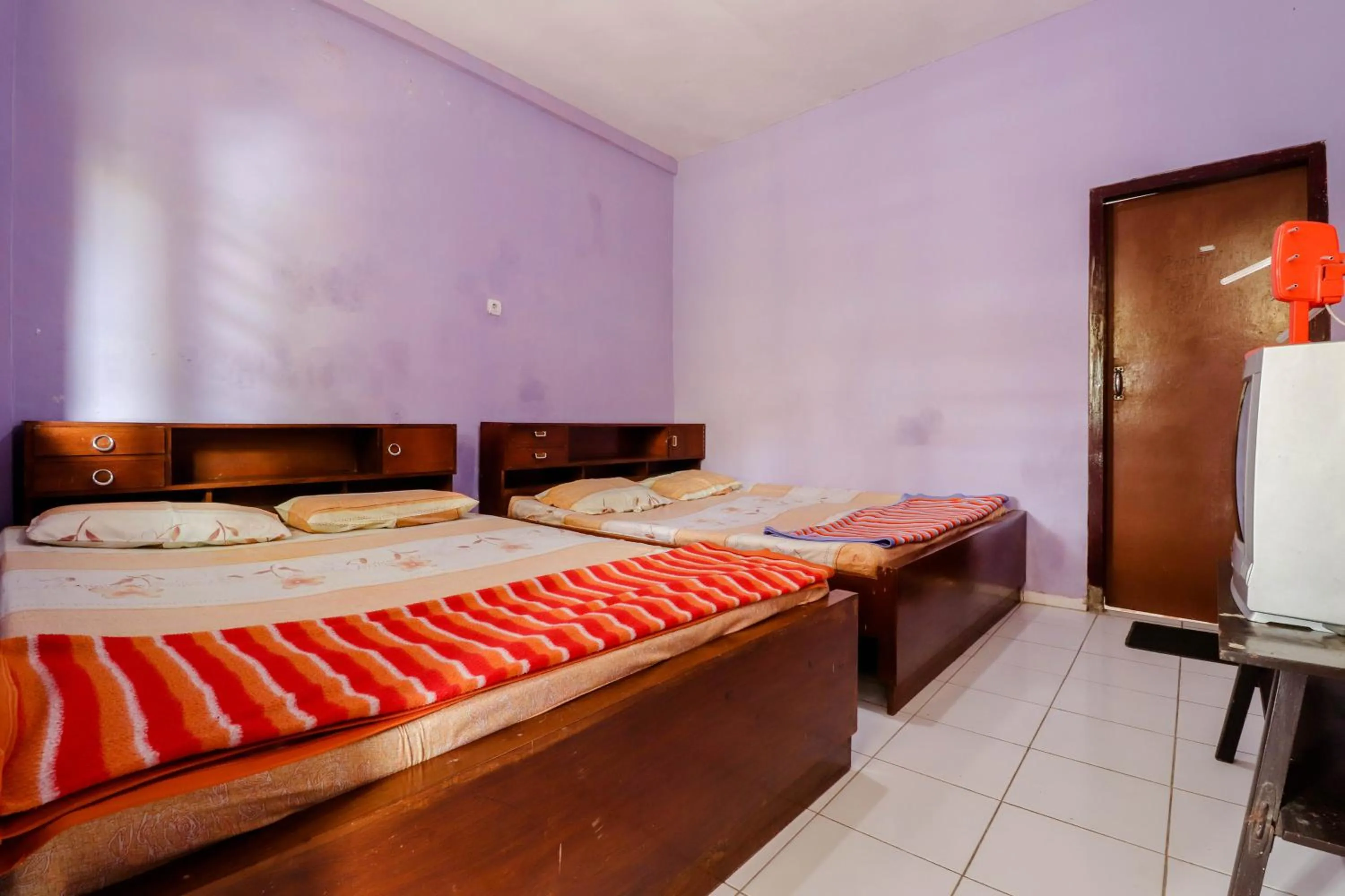 Bed in Penginapan Sedyo Rahayu